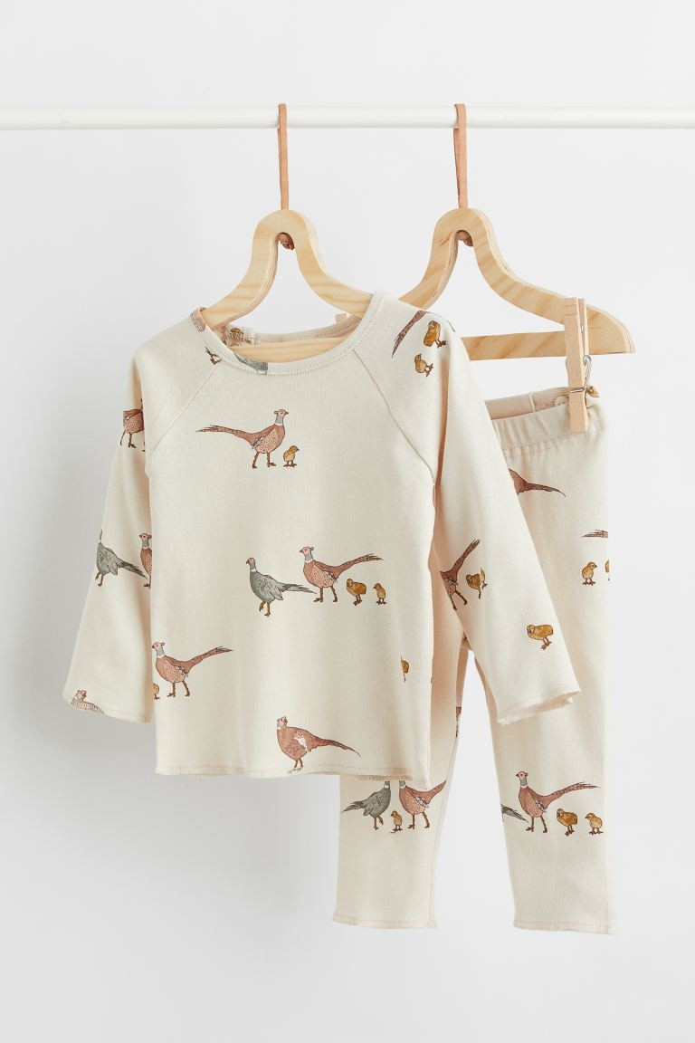 Conscious choice  Baby Exclusive. Two-piece set with a top and leggings in soft, organic cotton j... | H&M (US + CA)