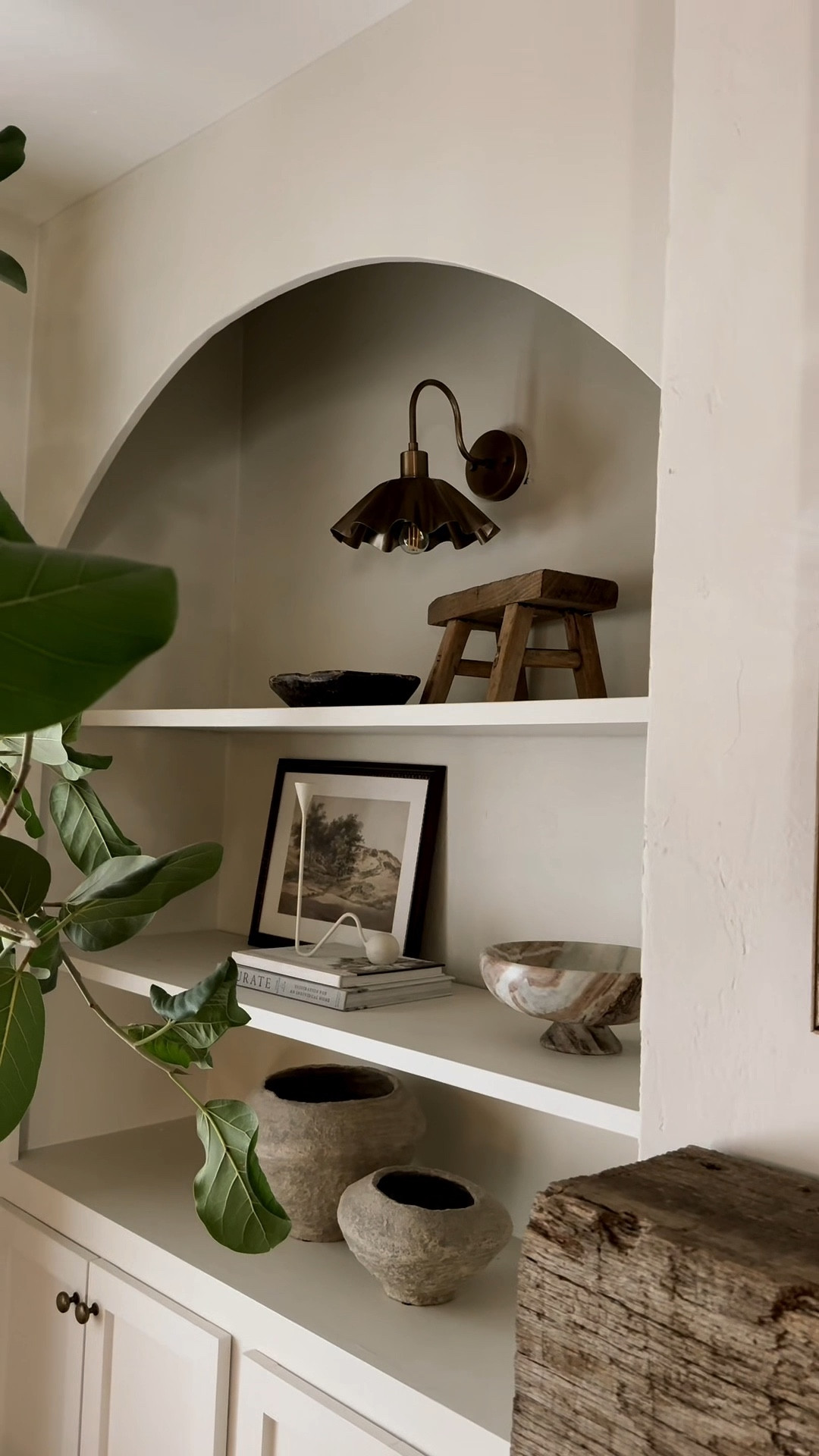 I found these antique brass scallop metal wall sconces on @Etsy and I am obsessed!! They come in tons of colors. Mine are hardwired but if you don’t want to hardwire - just hang them and get battery powered lightbulbs off amazon! Neutral spring living room. Coffee table decor and shelf styling. 

#LTKSeasonal #LTKHome