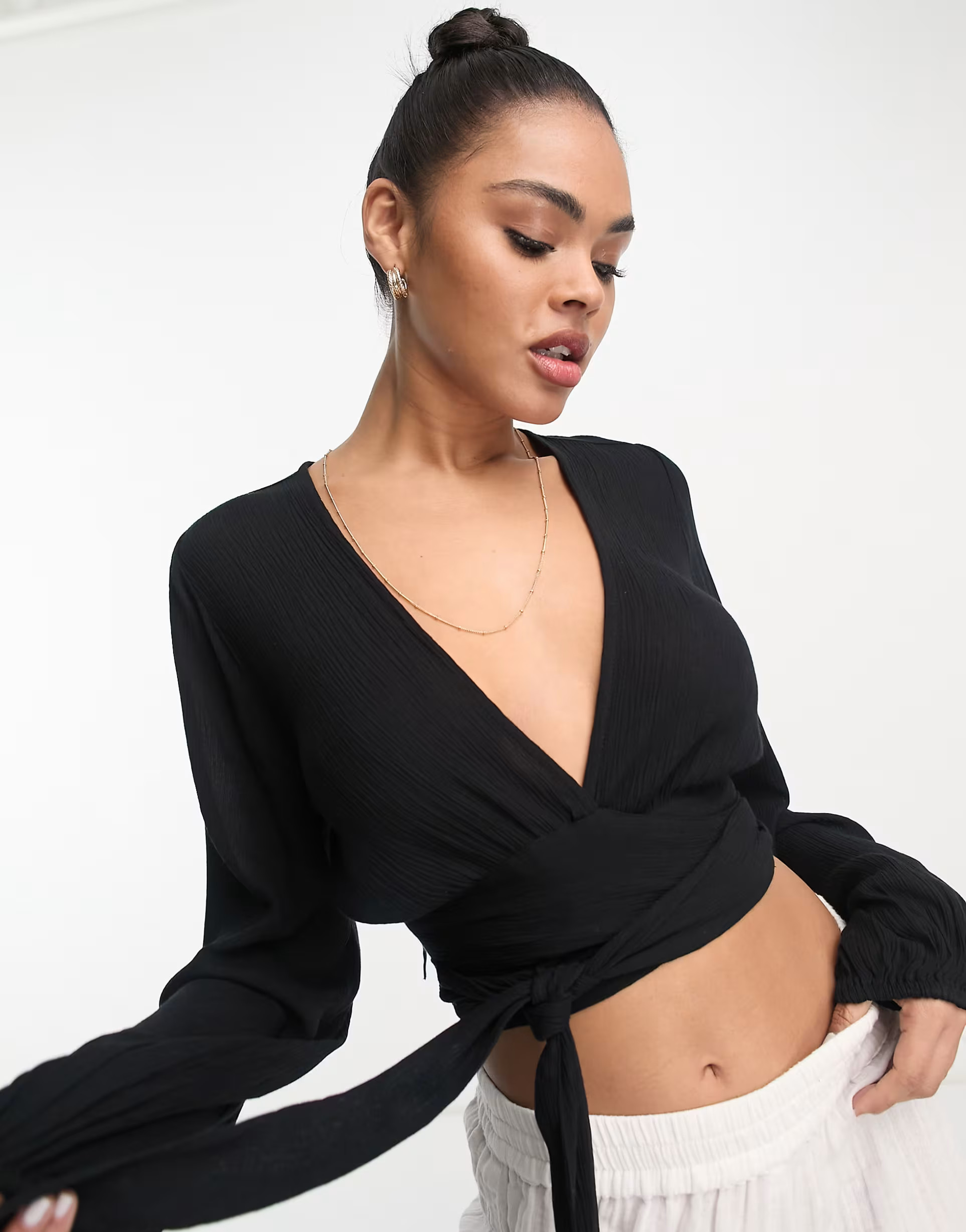 ASOS DESIGN wrap tie long sleeve beach crop top in black | ASOS (Global)