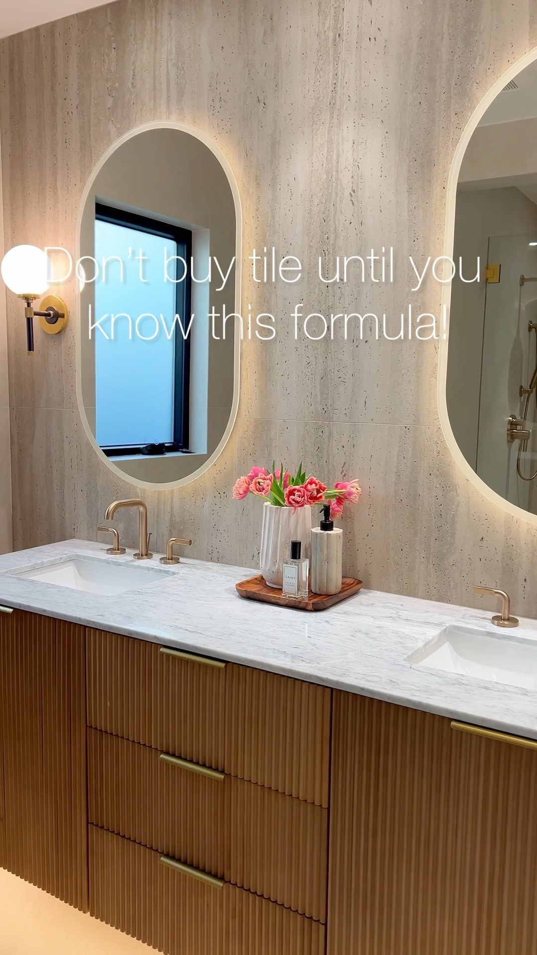 Reeded vanity, lighted mirrors, two toned sconces, champagne bronze faucet is a dream come true! 

#LTKHome #LTKStyleTip