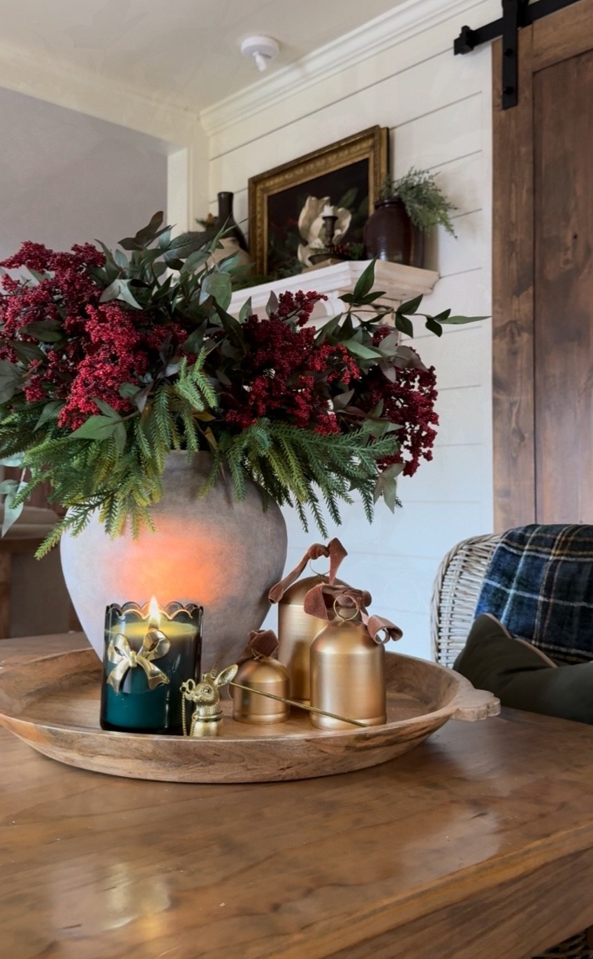 ✨ How to Build a Christmas Centerpiece That Feels Collected, Old-World, and Effortlessly Designer ✨
If you’re craving a Christmas centerpiece that looks high-end without the stress, here’s my favorite formula—easy, flexible, and absolutely stunning every time. Start with any tray as your base, then anchor the look with a piece of old-world inspired designer pottery—the kind with a beautiful aged patina that brings instant character and charm.
Next, build your foundation using greenery stems. Faux or fresh works—just make sure it spills naturally over the rim to create that lush, timeless Christmas feel. From here, you have options:
• Add red or white berries for a classic holiday pop
• Use magnolia stems for an elegant Southern touch
• Or tuck in red roses for a romantic, moody Christmas moment
Sometimes I love to finish the vase with a simple bow for extra charm. Then, decorate the tray with a few accent pieces—candles, bells with bows, marble trees, a deer statue, or anything beautiful you already have at home.
Here’s the design rule that makes it foolproof:
⭐️ Use odd numbers.
The vase + arrangement counts as one item. A cluster of three bells counts as another. A single candle in front could be your third. Our eyes are naturally drawn to groups of three, and that’s why this layout always feels balanced and intentional.
This simple method works for any Christmas centerpiece—mix and match pieces you love, play with scale and texture, and let your personality show. That’s what turns decor into something magical. ✨🎄
#ChristmasCenterpiece #HolidayDecorIdeas #OldWorldChristmas #DesignerHolidayDecor #ChristmasStylingTips #HomeDecorInspo

#LTKstorytime #LTKHome #LTKHoliday