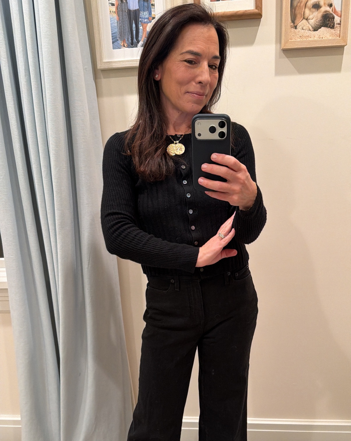 Head-to-toe black always works and the proportions here flatter. Fitted top and a black jean (or pant) with some volume on the bottom. Pops of gold in the jewelry and the clutch  

#LTKootd #LTKgrwm #LTKdayinmylife