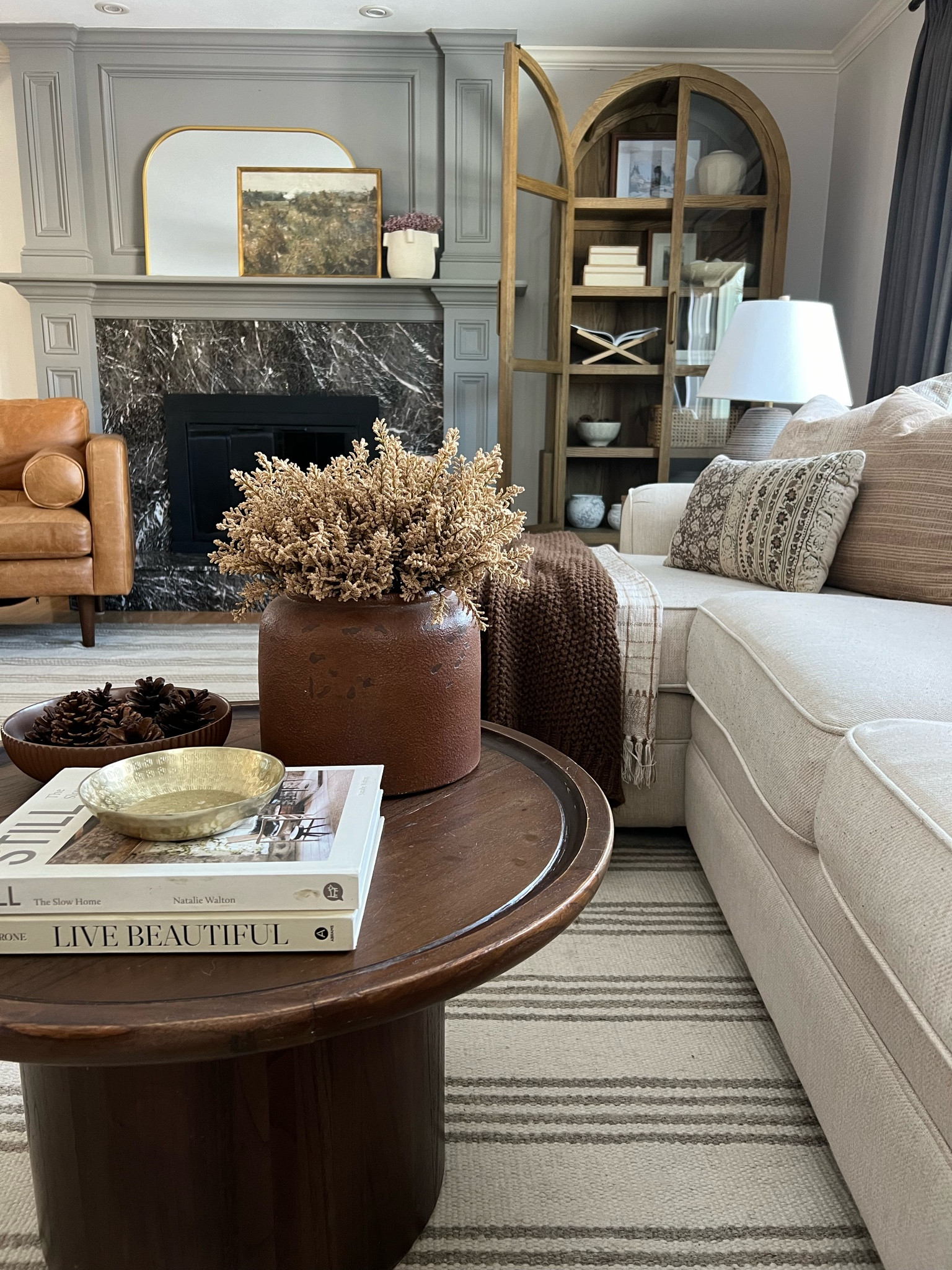 Organic modern living room 

Round oak coffee table
Cream sectional sofa
Lulu Georgia
Contact chair
Arch cabinet styling 
Rugsusa rug
Stripe cream rug
Neutral rug
Poly bark chair
Studio McGee decor
Moody home decor 

#LTKSeasonal #LTKsalealert #LTKhome