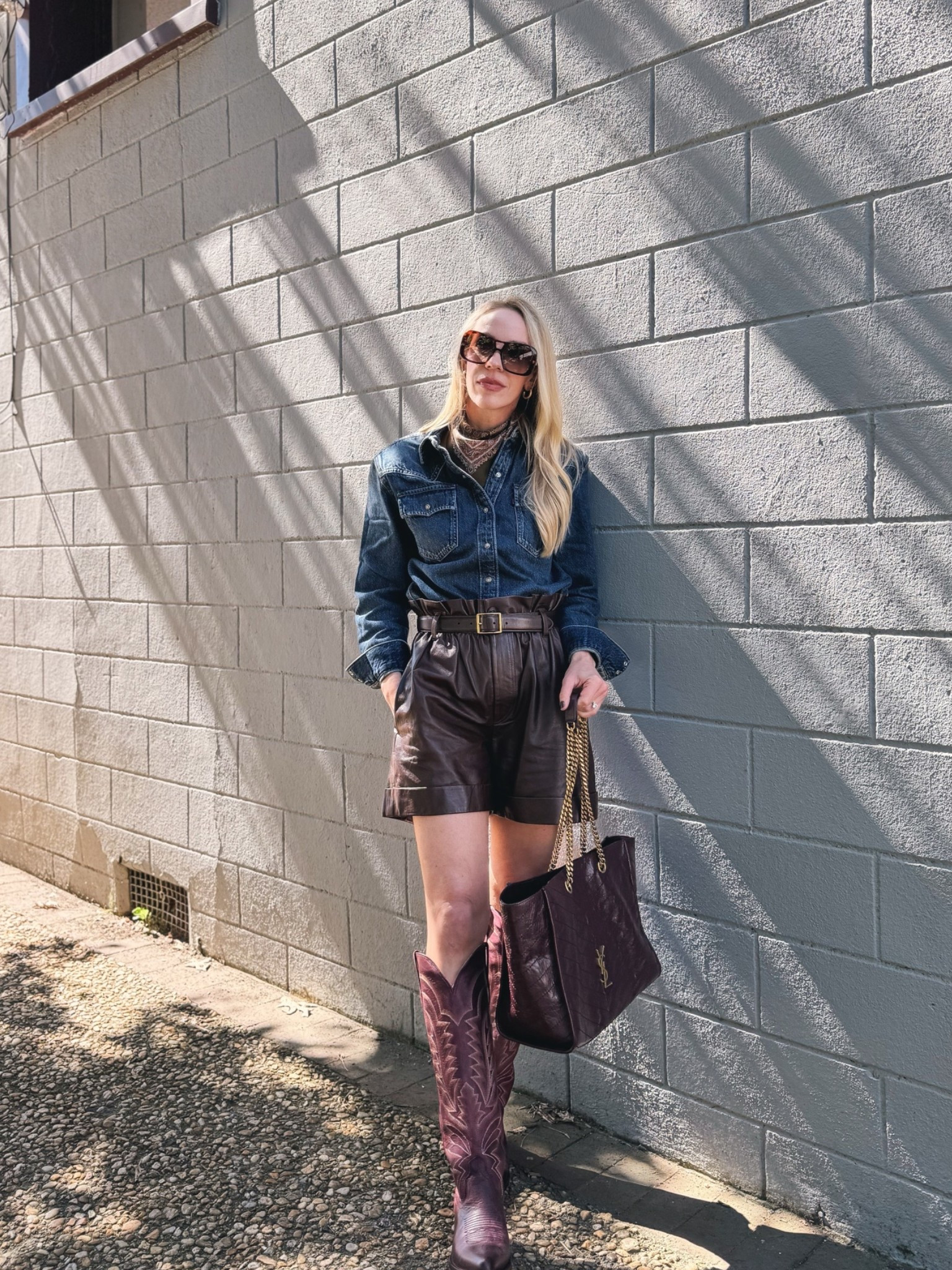Western chic fall outfit, @levi shoulder pad denim shirt, paisley silk scarf, leather shorts with cowboy boots, @Tecovas burgundy western boots

#LTKSeasonal #LTKOver40 #LTKSaleAlert