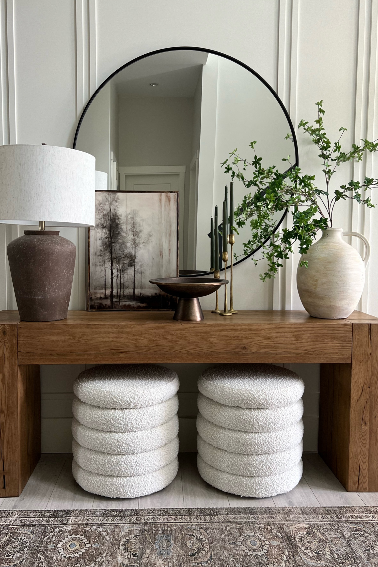 Spring console: Oversized pieces making a statement here! 
This is a 45” mirror..love the large scale look. The boucle  ottomans are a large size too (22”). Bonus: they’re storage ottomans! 
Modern organic home decor, furniture 

#LTKhome