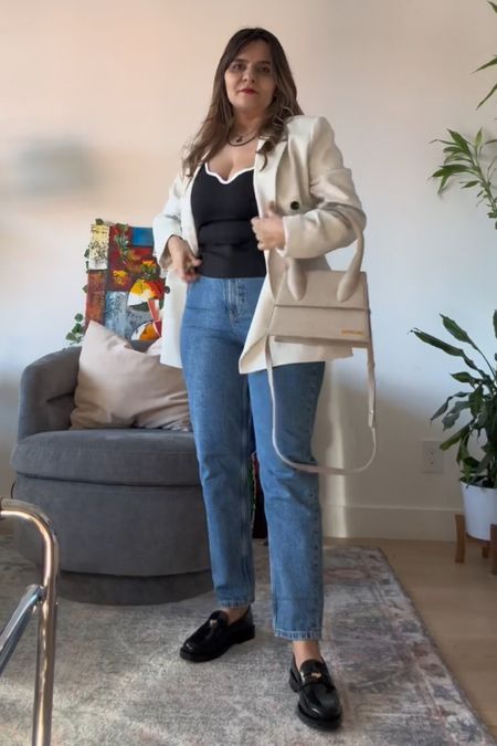 White blazer with loafers jacquemis bag mom jeans and channel inspired black and white tank too

#LTKSeasonal #LTKstyletip #LTKfindsunder100