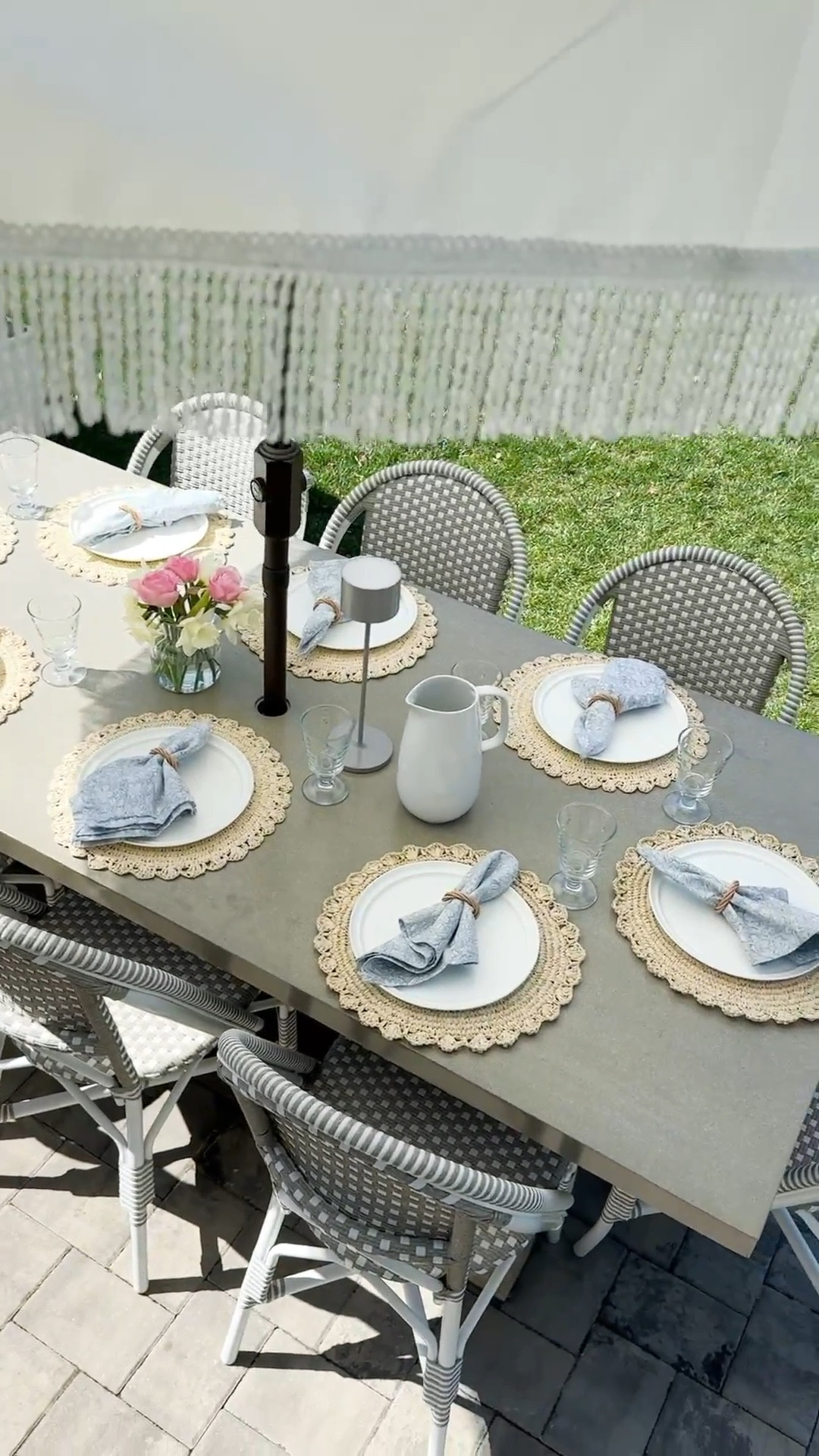 Concrete and teak outdoor dining table, French style bistro outdoor chairs, white tassel patio umbrella, Target woven placemats, Easter hosting 

#LTKmomlife #LTKHome #LTKSeasonal