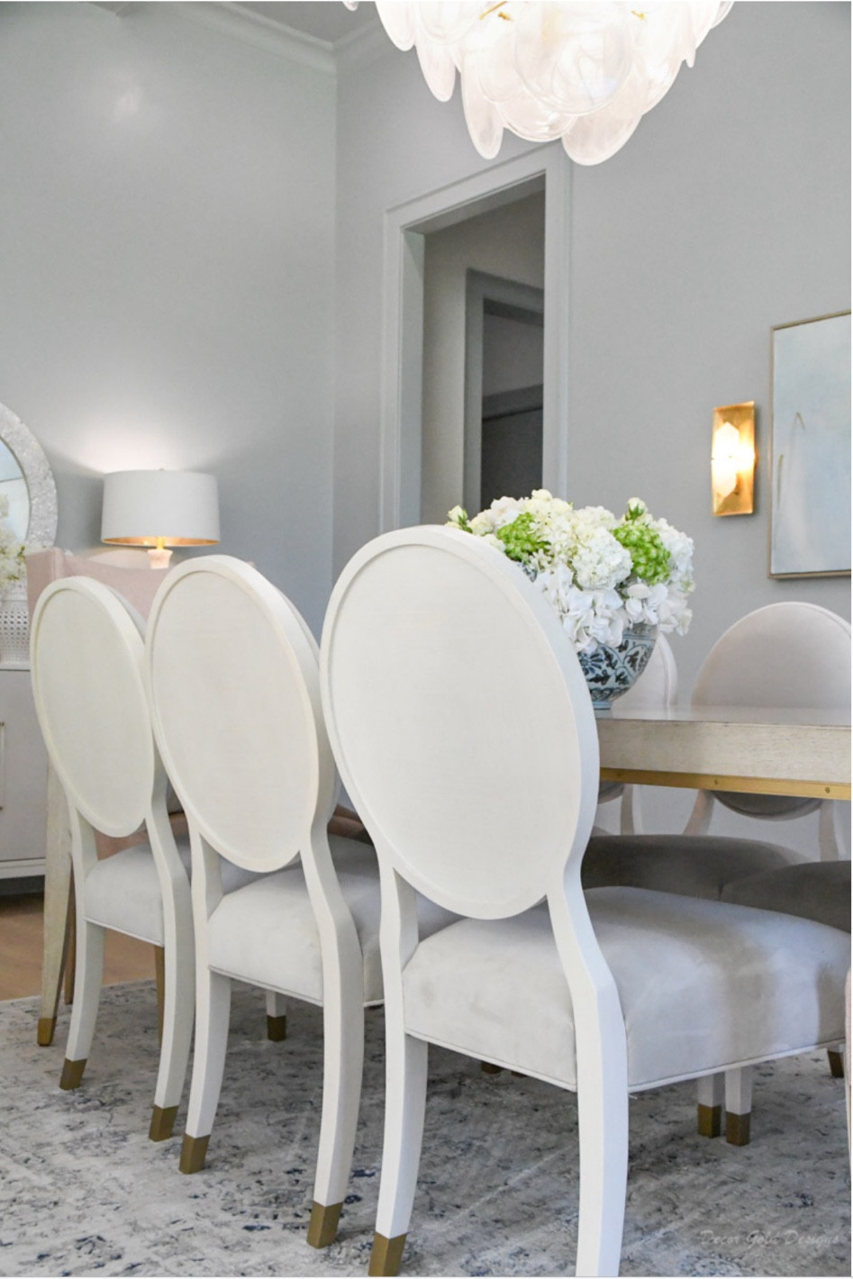 Dining room chairs, table, wall sconces, alabaster lamps

#LTKhome