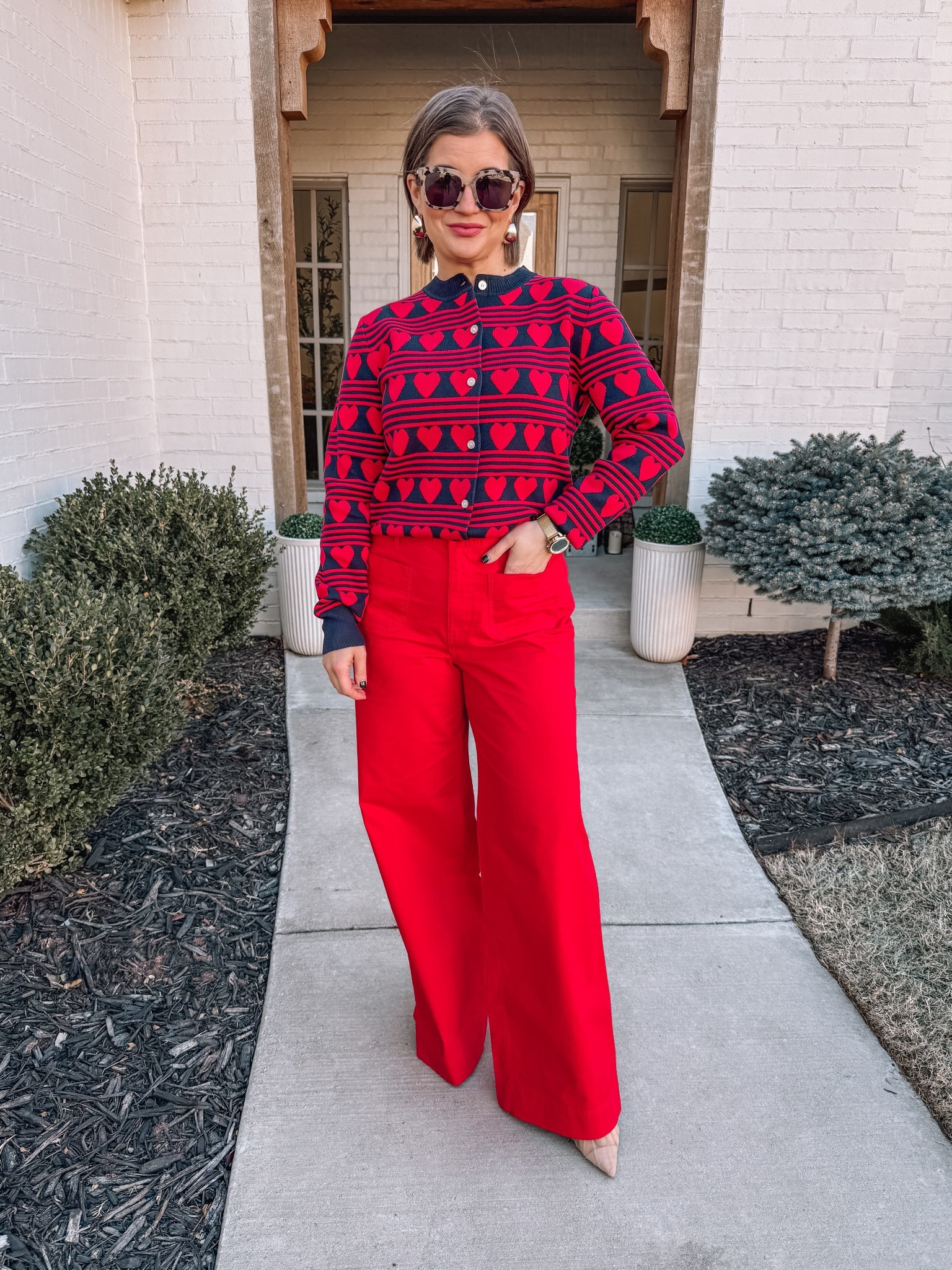 Walmart heart sweater and red pants! 

#LTKSeasonal #LTKSaleAlert