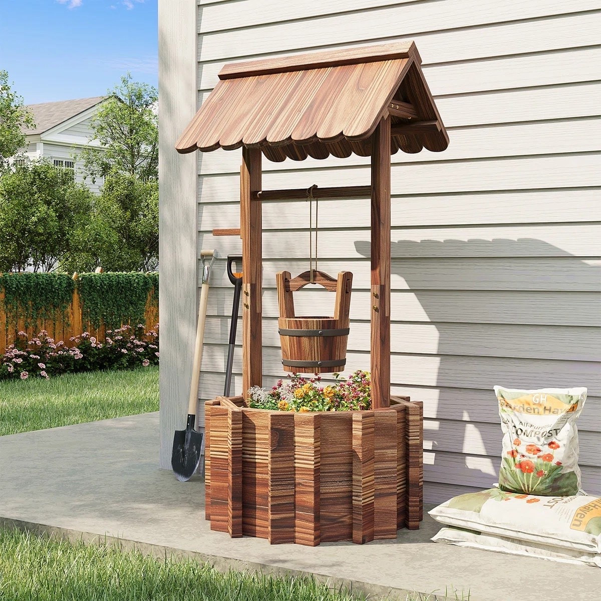 Inspired by charming cottage gardens, the Brenan Fir Wood Wishing Well Outdoor Planter brings storybook character and timeless appeal to your outdoor space. Its decorative wishing well design creates a beautiful focal point while providing the perfect home for colorful flowers and greenery. ON SALE and under $100.

Keywords:

* wishing well planter
* outdoor planter
* fir wood planter
* garden planter
* decorative wishing well
* cottage garden décor
* outdoor flower planter
* rustic garden accent
* backyard landscaping
* porch planter
* farmhouse outdoor décor
* flower display planter
* wooden garden planter
* patio décor inspiration
* garden focal point
* outdoor decorating ideas
* whimsical garden décor
* country garden style
* landscaping inspiration

#LTKSaleAlert #LTKHome #LTKSeasonal