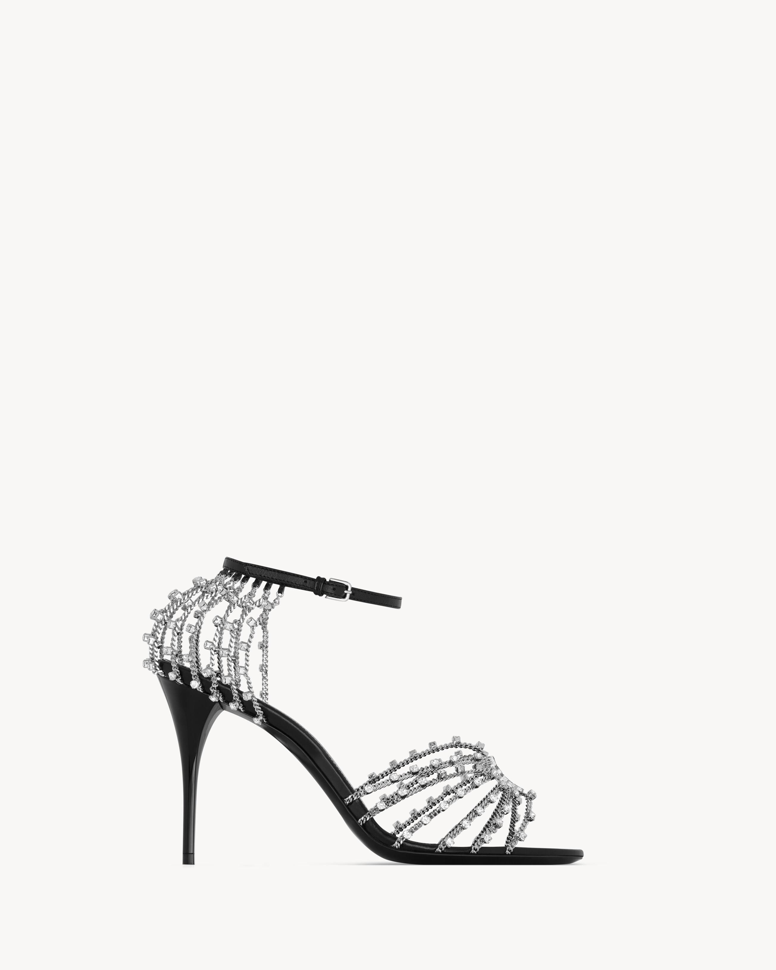 stiletto sandals decorated with the CASSANDRE, featuring rhinestone chain straps at the toe and h... | Saint Laurent Inc. (Global)