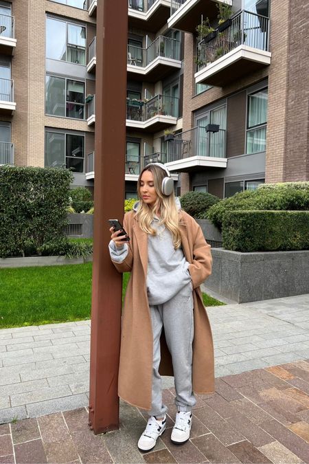 Activewear outfit idea for cosy Sundays. Grey tracksuit from Gymshark, belted mango camel coat, new balance trainers & AirPods Max

#LTKstyletip #LTKGiftGuide #LTKCyberweek