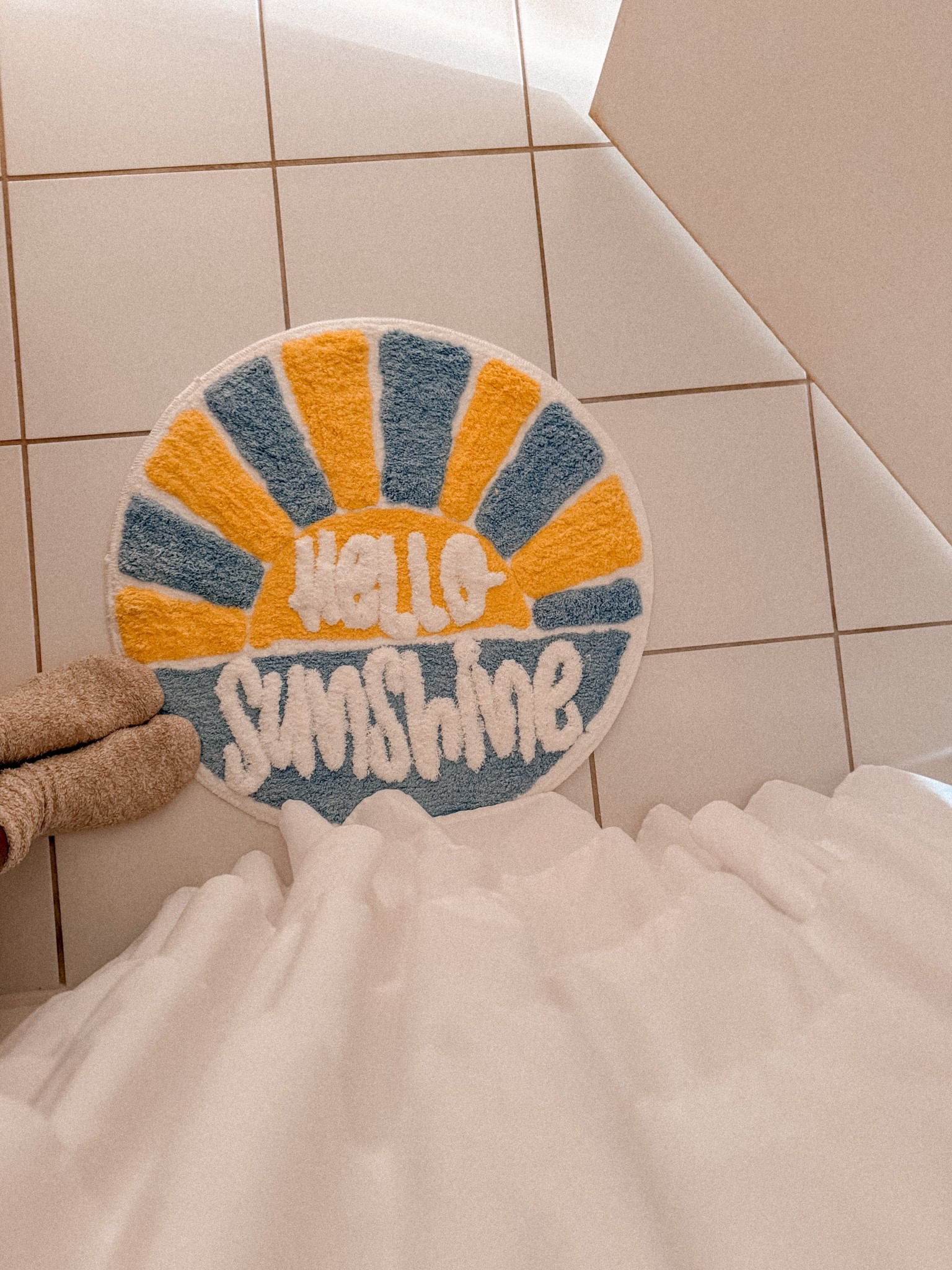 First time adding a sunshine ☀️ non traditional rug to our outdated bathroom! Loveeee!