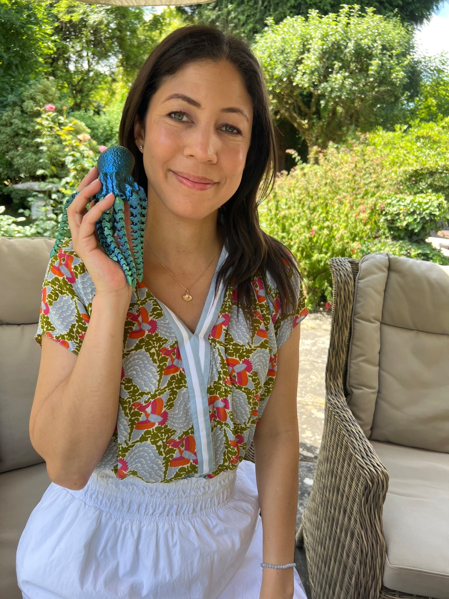 This is the outfit I wore on my birthday, and I have to say it made me feel so cheerful and put-together. The Short Sleeve Aspen Blouse from Rungolee is such a joyful piece with its intricate pattern and pop of color. It always garners compliments whenever I wear it! I’ve paired it with my trusty Quince organic poplin maxi skirt, which is as breezy and elegant as it is comfortable.

A sweet personal touch: my son gave me this adorable 3D-printed octopus for my birthday 🎁💙 He even took this photo of me posing with it, which makes it extra special. Moments like these remind me how lovely it is to dress up and make memories with the ones we love.
What do you like to wear on your birthday that makes you feel your best? I’d love to know 💫

#OutfitOfTheDay  #TenItemWardrobe #ElegantCasual #BirthdayLook 

#LTKSeasonal #LTKBeauty #LTKTravel