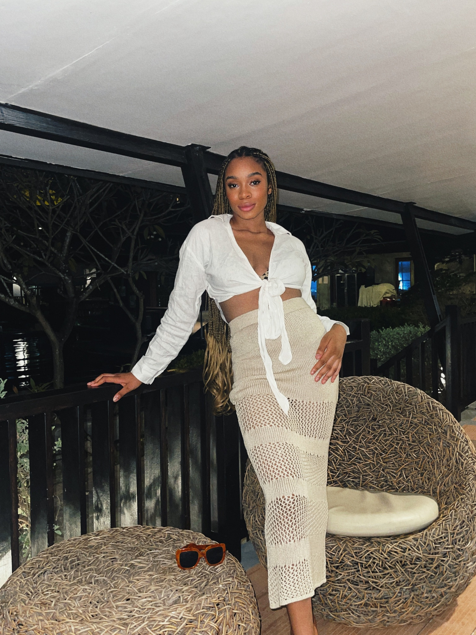 Women’s Tropical Vacation Outfit: Nude and brown long crochet skirt and white long sleeve cropped knotted shirt, nude heels and brown and orange glasses 

#LTKSeasonal #LTKaustralia #LTKtravel