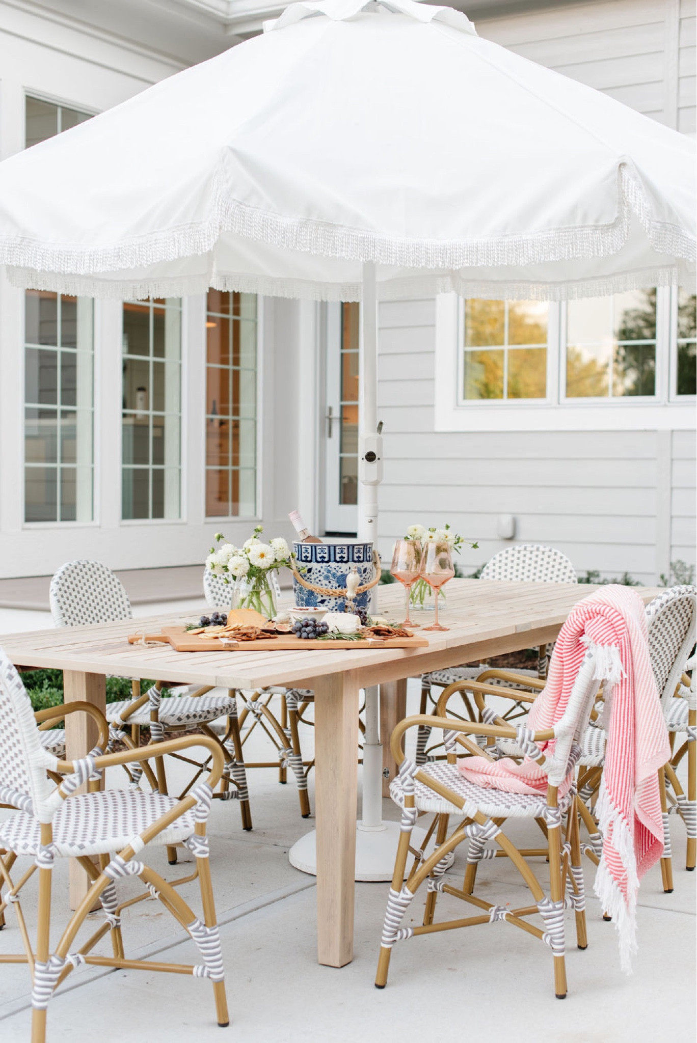 Patio furniture, backyard patio, outdoor dining furniture, outdoor table, outdoor dining, outdoor dining chairs, white fringe umbrella, white umbrella 

#LTKhome #LTKSeasonal #LTKFind