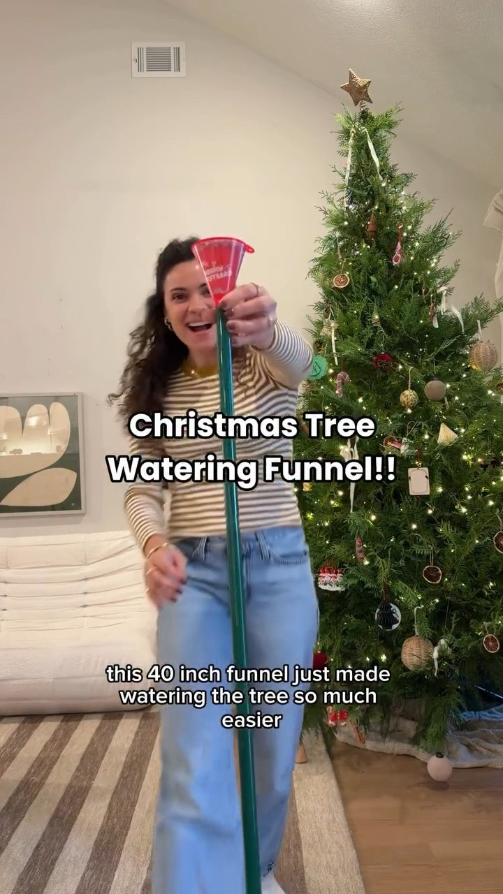 Where was this when I was growing up!? 🌲 Comment “TREE” to snag this INCREDIBLE funnel to easily water the Christmas tree!!!! No more getting on the floor to water the tree 😅😅 #christmastreehacks #christmashacks