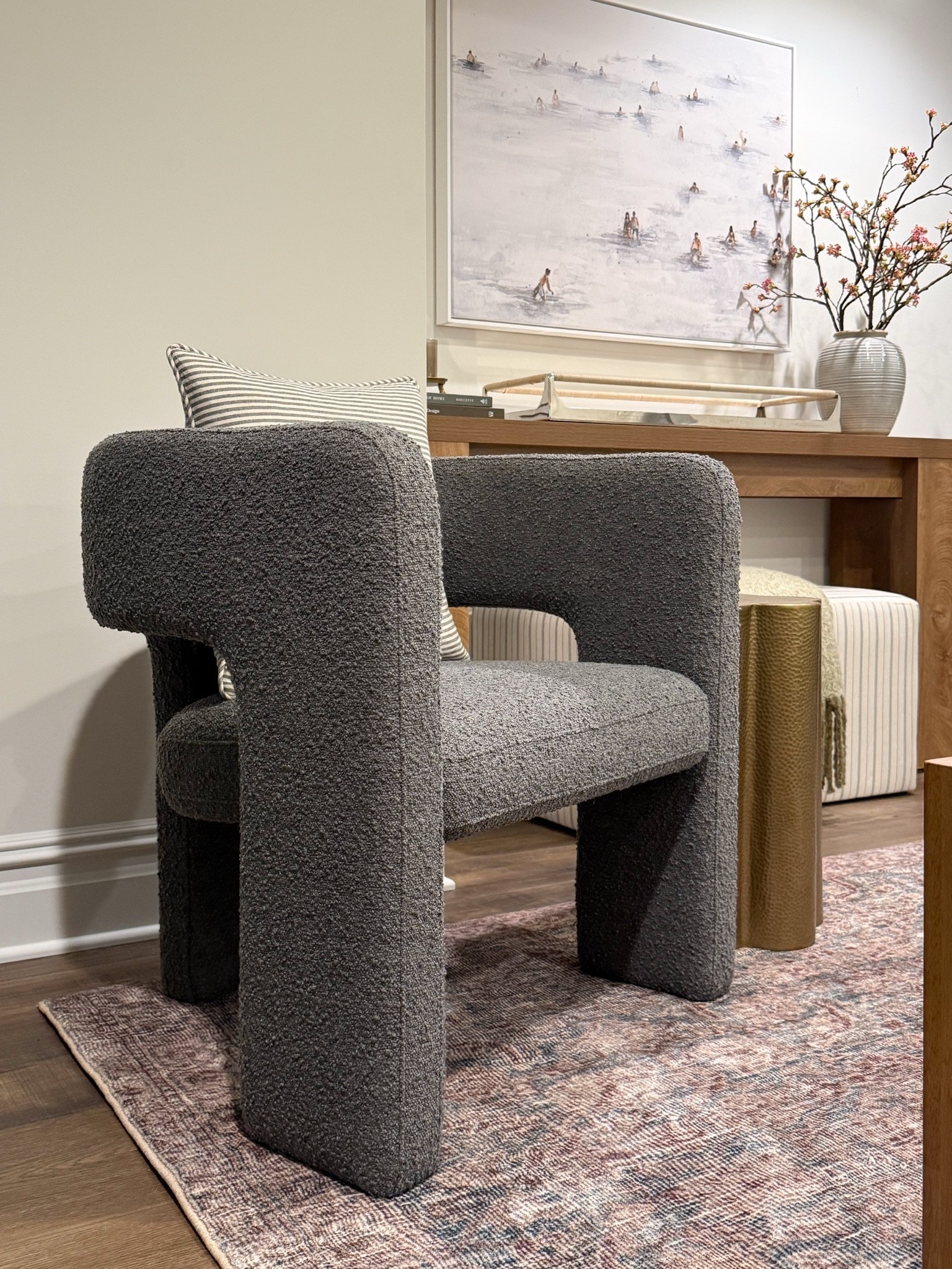 I love mixing a sculptural chair with softer textures to keep a space feeling warm and inviting. The boucle fabric adds so much dimension, and paired with a simple striped pillow and vintage inspired rug, it creates a cozy corner that feels both elevated and comfortable.

boucle accent chair, sculptural chair, reading nook, cozy corner, neutral living room, basement décor, home styling, accent furniture, modern home décor, Girl on the Hudson

#LTKHome #LTKmomlife