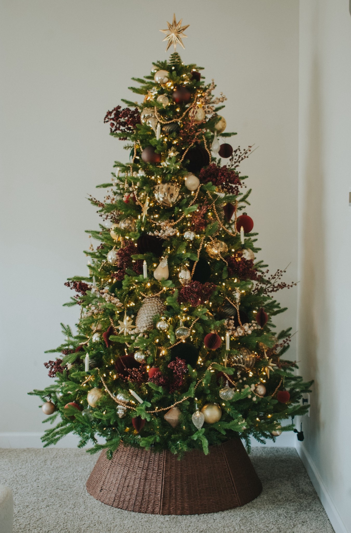 Elevated earthy Christmas tree. Burgundy ornaments. Gold Christmas. Bead garland. King of Christmas. Christmas tree ornaments. Holiday decor. 

#LTKHome #LTKSeasonal #LTKHoliday