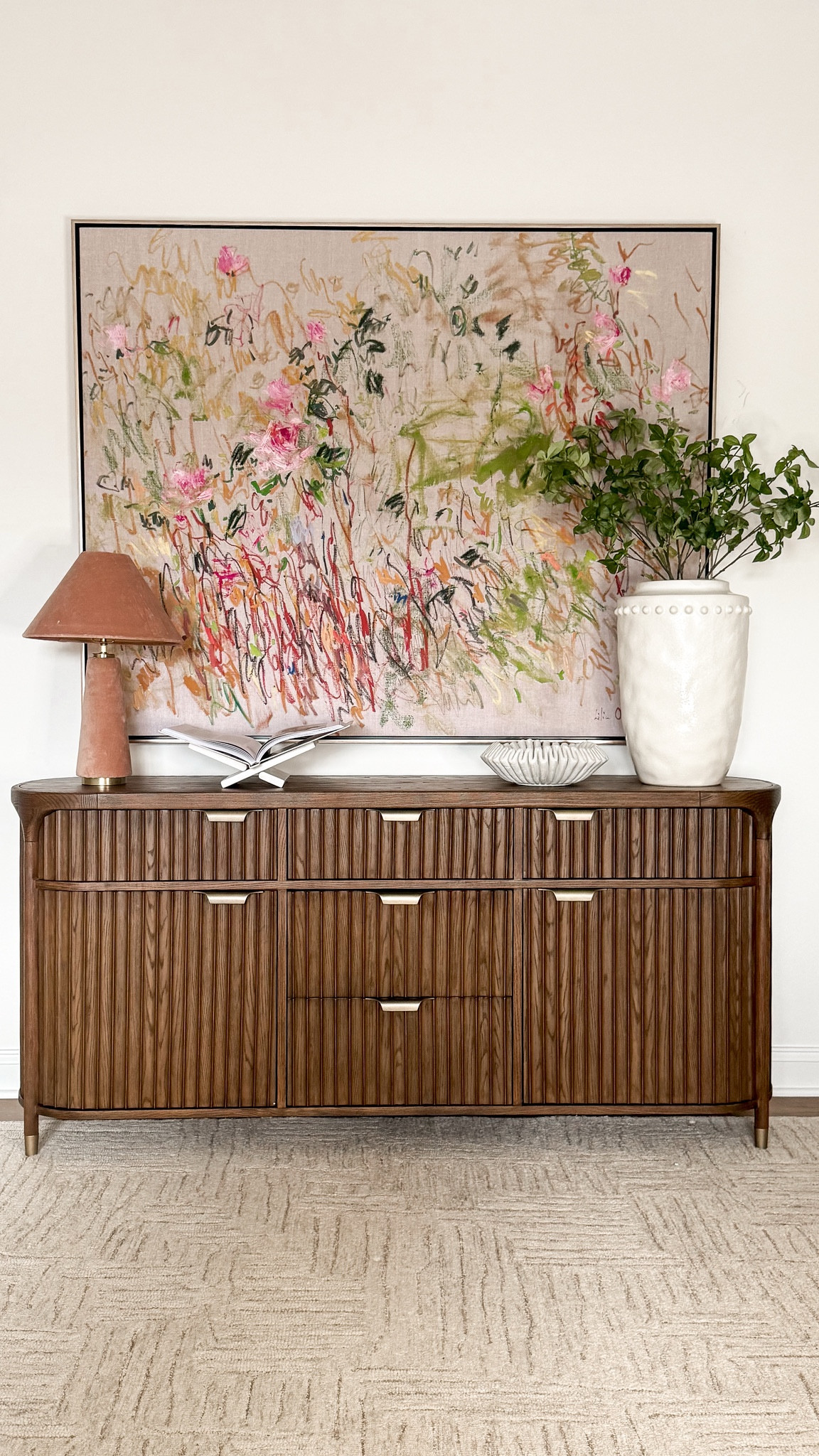 These Anthropologie finds are so good! Home decor, fluted sideboard, lamp, vase, artwork, marble book holder, books

#LTKOver40 #LTKHome #LTKStyleTip