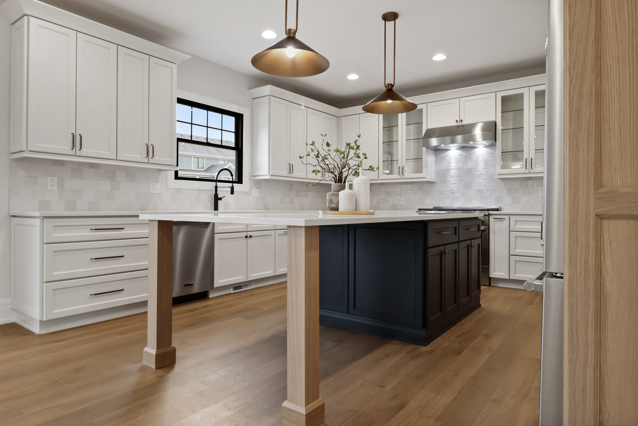For this new construction kitchen, wood flooring adds warmth to a modern black and white kitchen.  To further balance the cool toned space we added a statement with the unique shape of these over island pendants.  They add character to an already gorgeous kitchen and truly set the space apart. 

Quartz Countertops - Calacatta Laza from MSI Surfaces 

Backsplash - Portmore White 4x4 Glossy Ceramic Tile from TileBar 

 

#LTKHome #LTKStyleTip