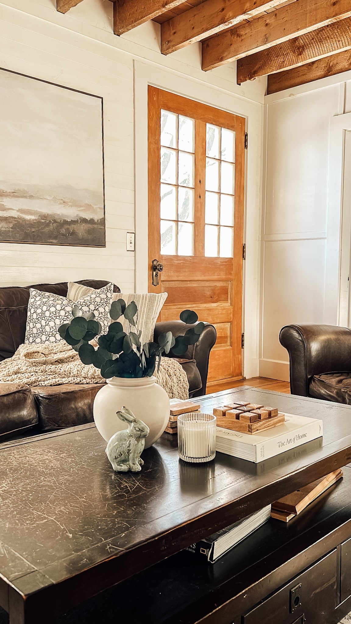 Coffee table styling for Spring | Adding a vase with dried eucalyptus, a ribbed glass candle, and the cutest blue bunny! Loving the mix of fresh blues and greens with our neutral styled home. It’s the little details that bring character + charm to your space for Spring! 

#LTKSeasonal #LTKHome