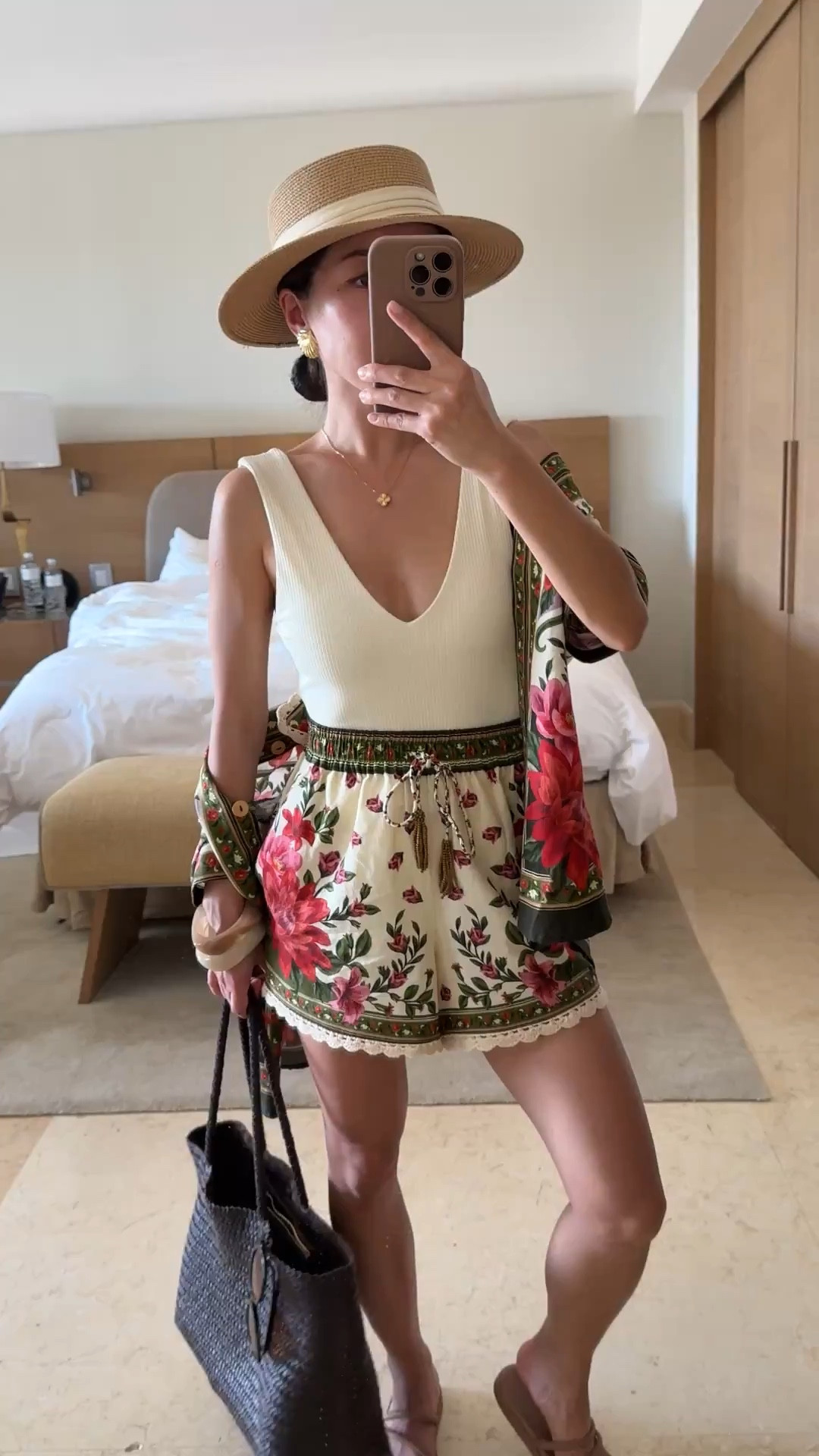 • Farm Rio shorts runs a bit small . XXS is 23.5” around the elastic waist. pockets. In hindsight, I could’ve sized up to XS for a looser waist fit.

• (on sale in burgundy!) Montce swimsuit xs, petite and short torso friendly, TTS soft comfy and great quality, classic cut with removable waist belt.  higher cut leg and higher cut front 

• amazon adjustable hat 

• Farm Rio linen blend button down shirt xxs, oversized fit, longer length 
Both of these farm Rio linen pieces get softer with wash and wear! I do machine cold delicates cycle in a mesh bag￼

• crocs sandals 5. Size Down if between sizes. Water friendly so a great mom shoe for poolside / water play too.

• Woven shoulder bag

• Madewell oval sunglasses

Beach / pool outfit, vacation resort style,  floral matching set

#ltkpetite #ltkseasonal #ltkswim
