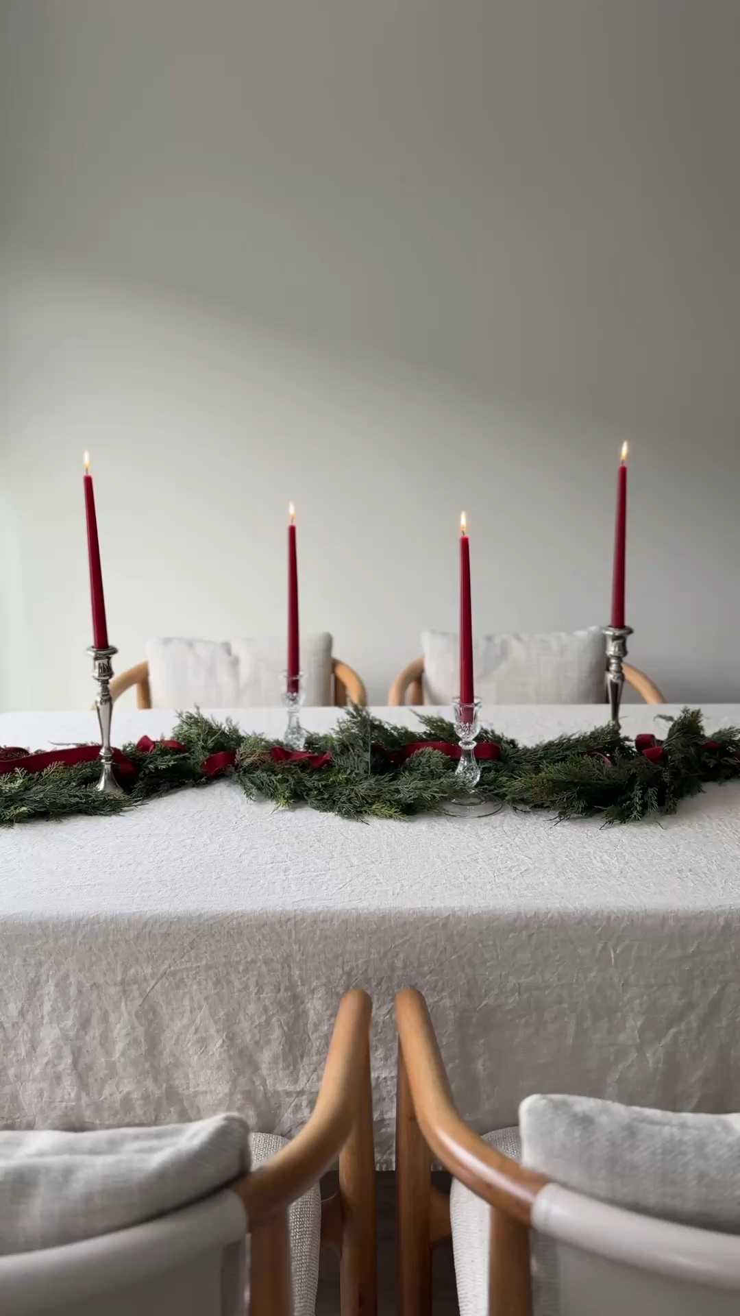 there’s something about a simple holiday table that feels like its own little love letter to the season ♥️ lush cedar, deep red tapers, and that soft afternoon light that only december can give. this garland from @christmas_central instantly made the whole room feel warmer, greener, more alive.

i wove velvet ribbon through the branches, set out my crystal candlesticks, and suddenly the simplest things like dinner with the people you love or a slow evening at home felt special again. sometimes all a table needs is a little greenery to become a memory.

#ad #ChristmasCentral #ChristmasCentralFinds #Northlight

#LTKSeasonal #LTKHoliday #LTKHome