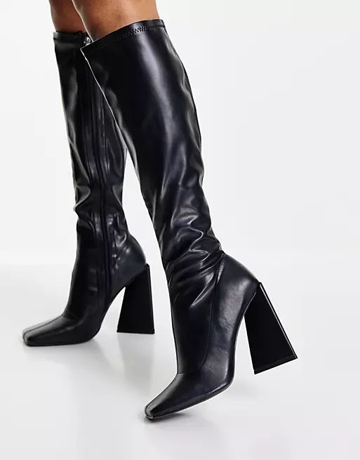 Public Desire Peggy flare heel knee boots in black | ASOS (Global)