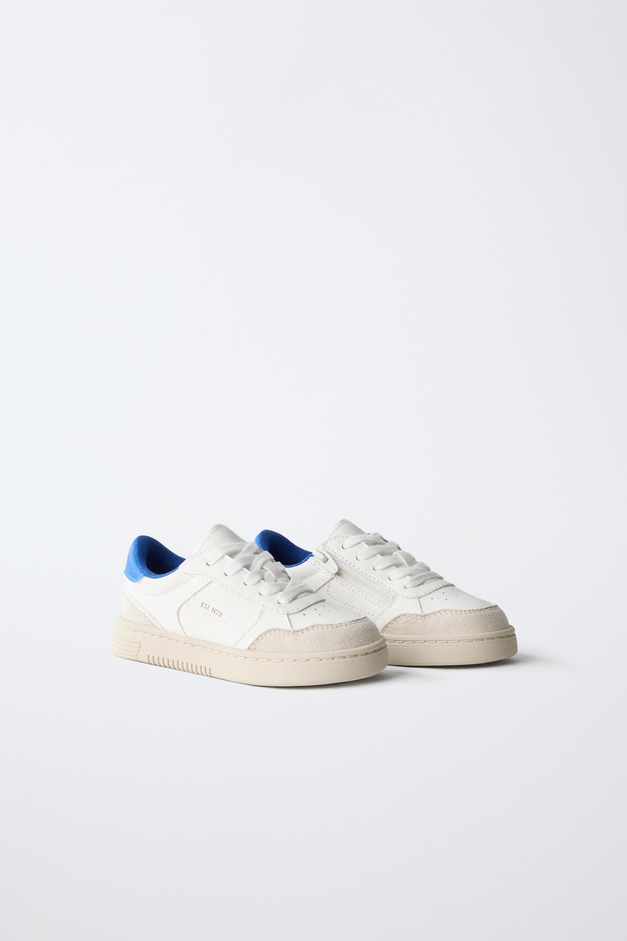 Leather sneakers with a contrasting color design. Features lace-up and side zip closure. Finished... | Zara US