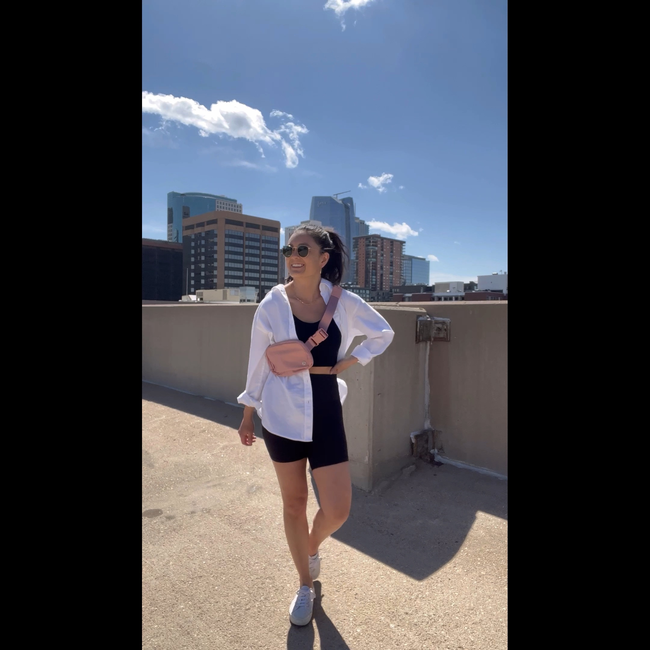 Spring outfit idea. Lulu lemon align biker shorts 6 inch. Urban outfitters ribbed tank top. White button down. White sneakers. Lulu lemon belt bag. Spring style. 

#LTKunder100 #LTKFind #LTKSeasonal