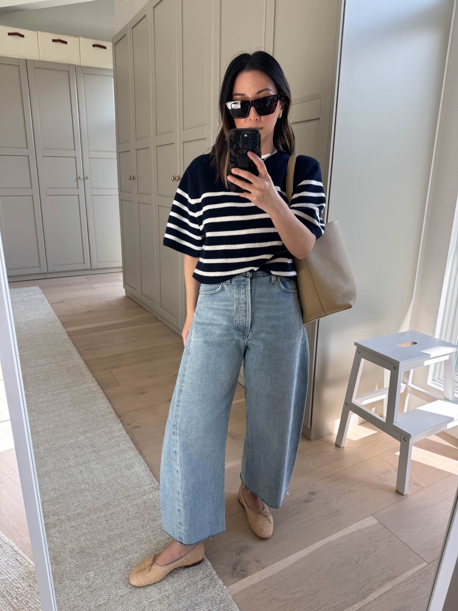Classic spring outfits. 

Banana Republic knit tee small - old
AGOLDE Luna jeans 25 - cut hems
Mansur Gavriel flats 35
The Row park tote medium 
Dorsey James necklace 15”
Quince earrings
Celine sunglasses 

Petite style, mom style, spring outfits 2026

#LTKgrwm #LTKPetite #LTKmomlife