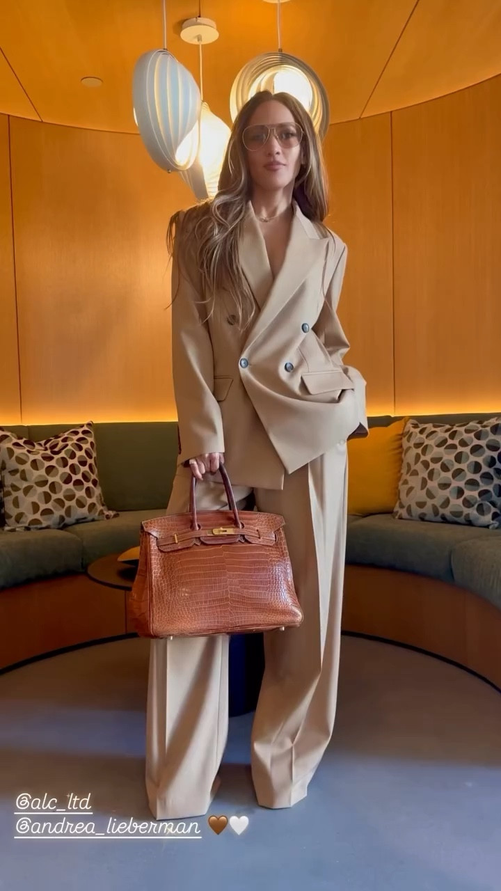 Jennifer Lopez J Lo  jacket lightweight stretch wool blend with a subtle twill texture. This oversized, double-breasted blazer features flap pockets and menswear-inspired tailoring. Matching Pant is crafted from light, drapey wool gabardine. This mid-rise, menswear-inspired silhouette features a single front pleat for a refined, effortless look.