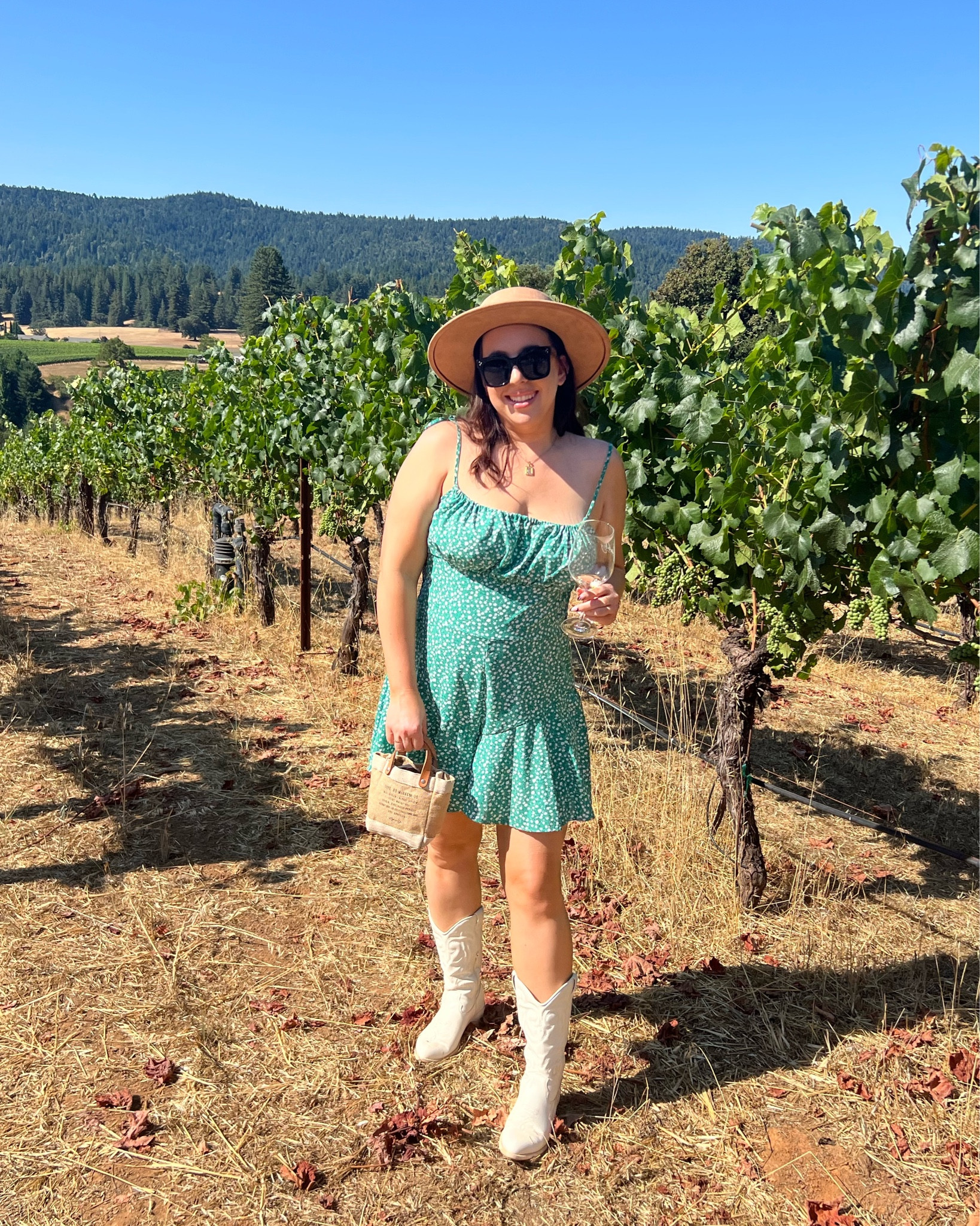Wine tasting outfit / green floral romper / white cowboy boots / mini straw tote bag

#LTKmidsize #LTKstyletip #LTKFind