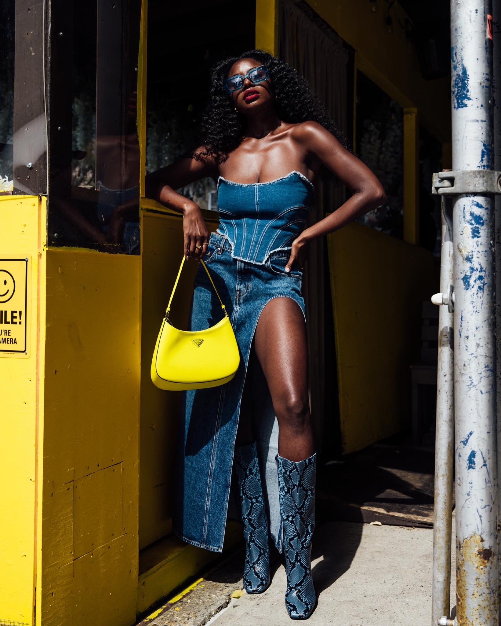 Denim look for fall! Denim corset, denim skirt with high slit, yellow Cleo Prada purse and blue snake print boots  

#LTKshoecrush #LTKstyletip