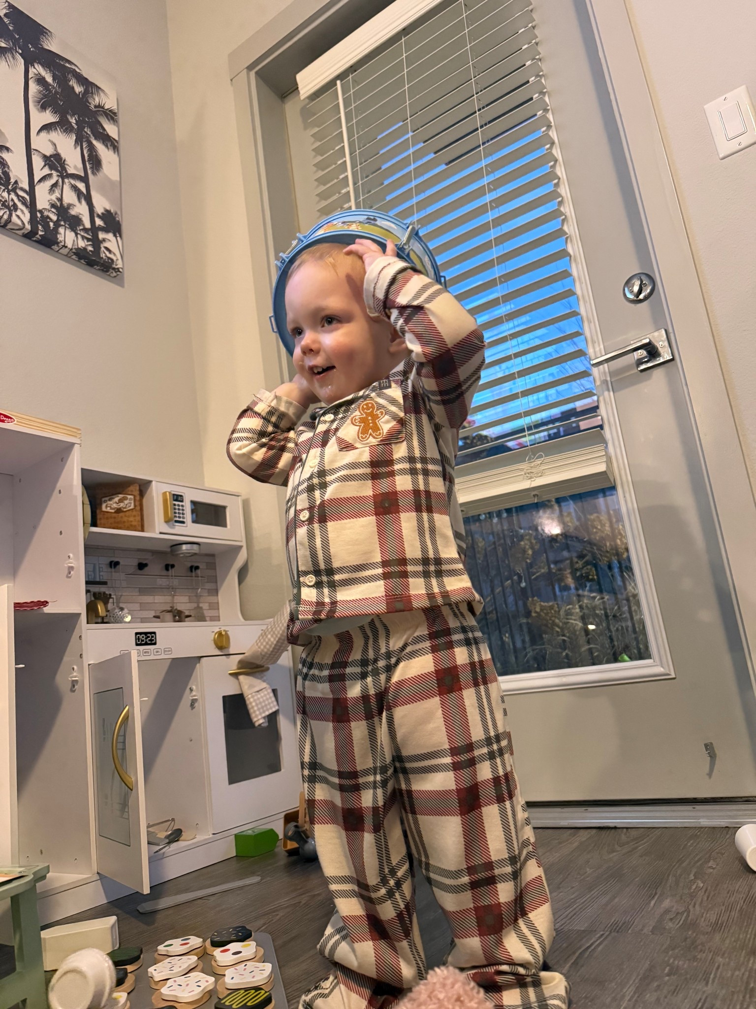 The cutest little checkered gingerbread pajamas and peep the play kitchen in the background. Both are perfect for your toddler and the kitchen will grow with them for years! 

#LTKGiftGuide #LTKKids #LTKmomlife