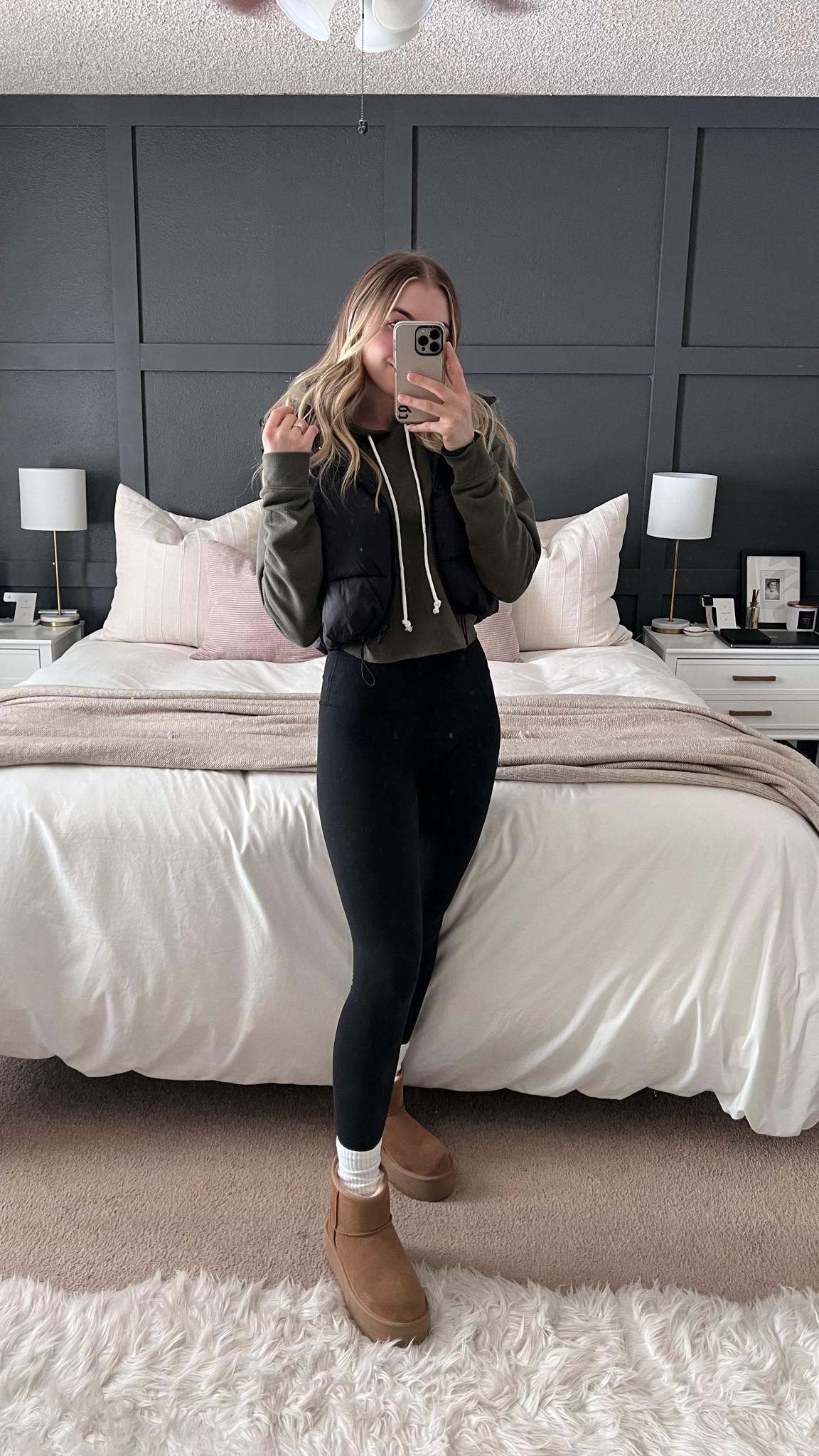 cozy winter athleisure ❄️ cropped hoodie, olive green hoodie, cropped puffer vest, target finds, lululemon dupes, black leggings, quality leggings, slouch socks, long white socks, uggs, ugg dupes, platform uggs, ultra mini uggs, cozy outfit, easy cute winter outfit, outfit ideas #competition 

#LTKshoecrush #LTKFind #LTKstyletip
