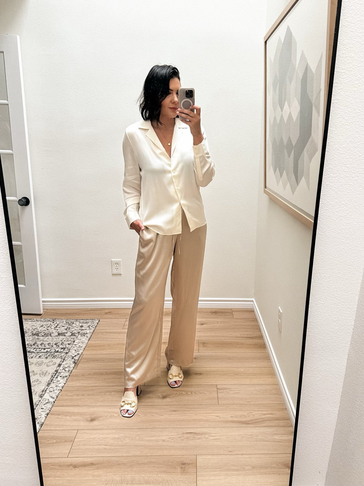 LOVE this silk blouse! The quality is top notch and the fit is nice. It is supposed to be more of a tailored fit, but I sized up so it would fit more relaxed (I don’t like silk tops to be too tight across my chest.) And I love how the large fits. 

If you want it to fit like on the model, stay TTS. If you want a more relaxed fit, go up one size. 

Here is a bit of a swerve: a nice pair of silk pants. That sure enough do not look like pajamas, which was my fear. They have enough structure and the length is perfect for heels. I paired them with this silk blouse and while I love a matching set, I think that if the top was the exact same color, it would look too pajama adjacent The offset of the colors but coordinating fabrics work perfectly. 

I am in the large of the pants, they run generous in the waist but I prefer this length for me. .  

 #LTKFindsUnder100 #LTKWorkwear