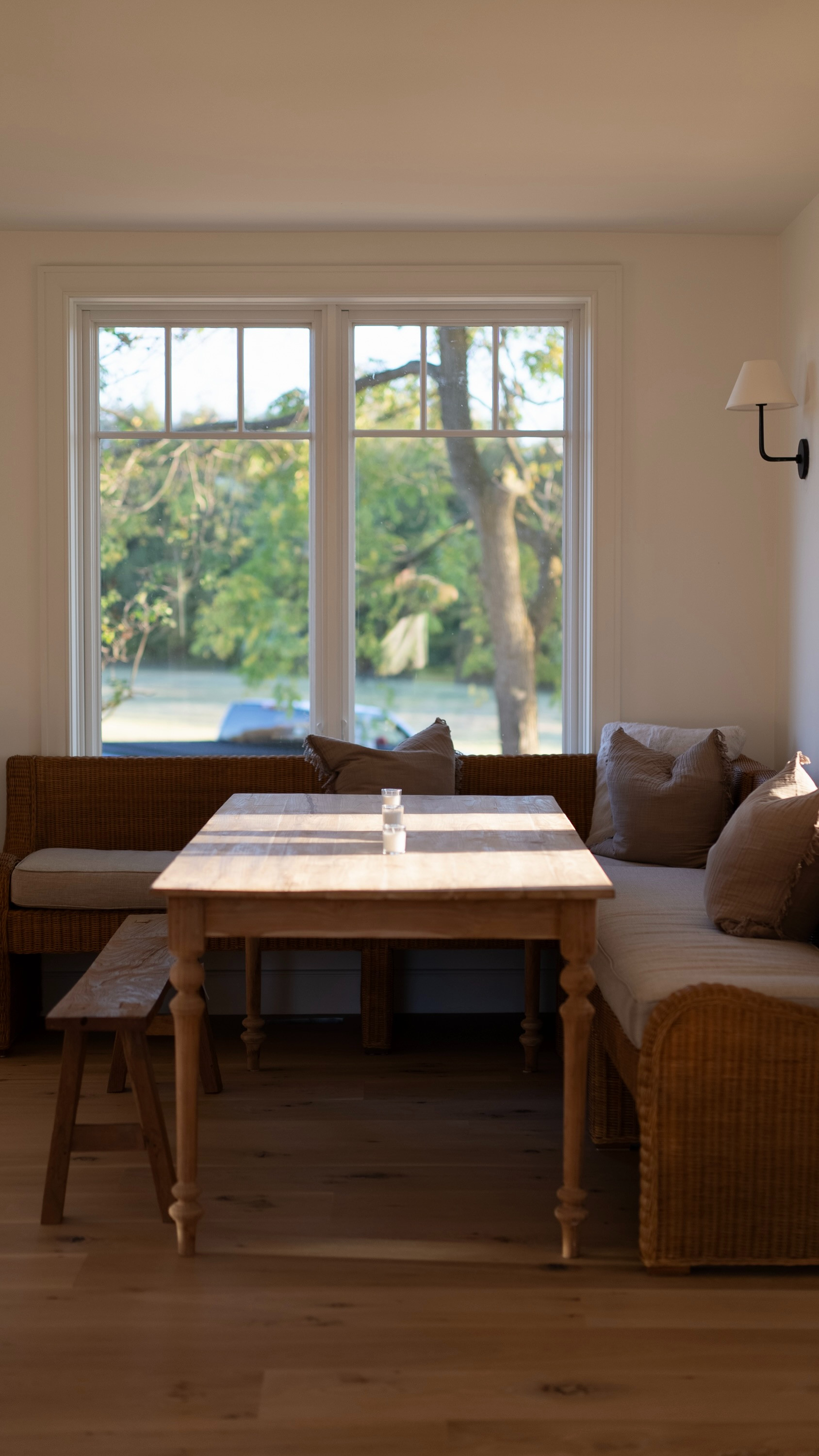 BANQUETTE LOVE : 

1. The dining room walls are painted in Simply White OC 117 by Benjamin Moore. We love colour drenching. The trim, walls and ceiling are all Simply White. For the trim, we do a slight sheen but everything else is matte. 


2. We bought our banquette in Bali as a custom banquette. We tagged some other banquettes that we love, that would be great alternatives. 

3. The throw pillows are from Ikea ! Love the colour and style. We double stuffed them to make them feel fluffier and more full. 

4. We love love love candles. It creates a gorgeous dining room vibe. We go for unscented. 

5. Tagged our wall sconce lighting source. We bought them from the US last year and we super love them. Since then, we also found that Lighthouse Co sells them in Canada. LOVE!

6. The beautiful windows are from Marvin Canada. They frame the dining space beautifully. They are soooo pretty, we didn't put curtains on them :) 

7. Our Oak flooring is custom made by our local mennonites. 

8. The table.. also from Bali.. but what we had on hand. Ideally, a true banquette style of table would be better, where the legs are in the centre, so that it makes it easy to get in and out from the bench seat. 

9. Our favourite banquette table is made by @shopacremade . Their quality is absolutely beautiful.  

 