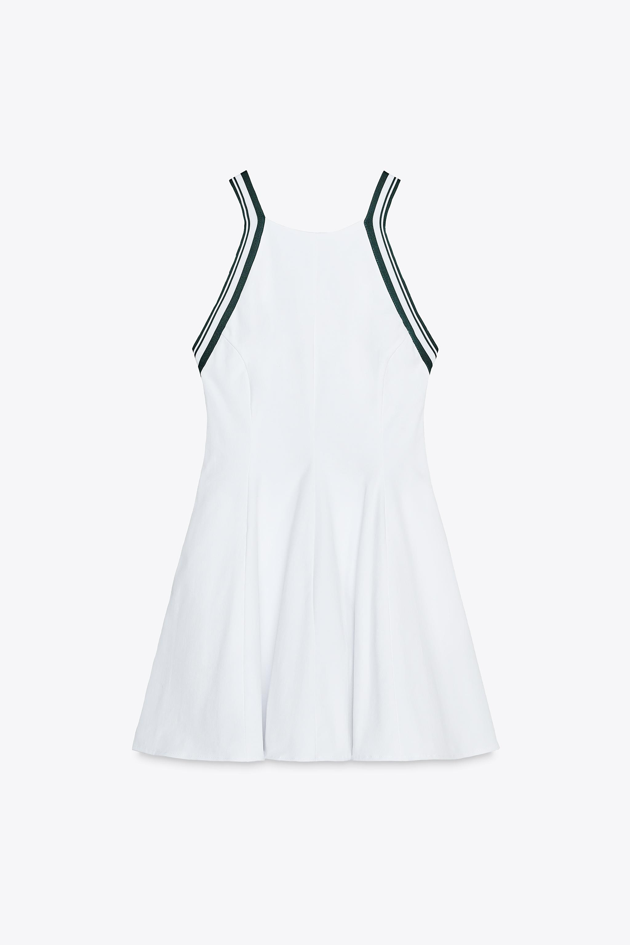 Short halter neck dress with crisscross straps at back. Hidden in-seam side pockets. Ribbed finis... | Zara US