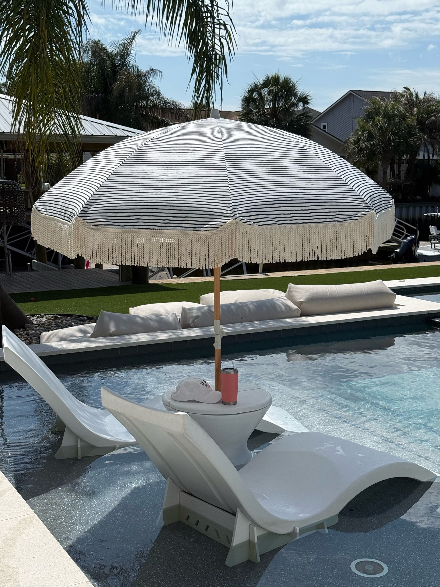 Chaise pool loungers risers Ledge Loungers striped umbrella with fringe

#LTKSeasonal #LTKHome