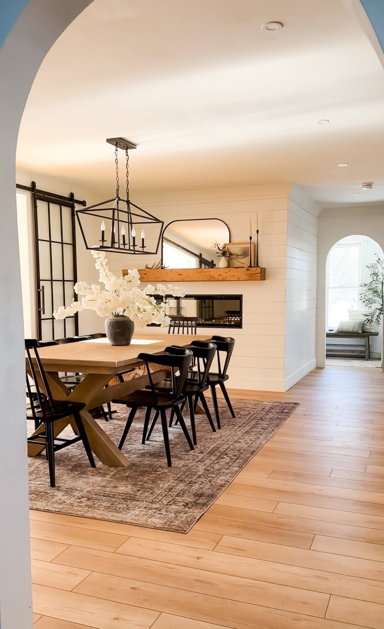 Spring ahead! Looking forward to birds chirping and spring decor 💫 Still love putting my electric fireplace on in my DR while we have family dinners. Love that you can set it with or without heat. 

🏷️ dining room decor // dining room inspo // electric fireplace // modern dining room // wood mantel // fireplace design // dining room chandelier // dining table // dining chairs 

#LTKSeasonal #LTKHome