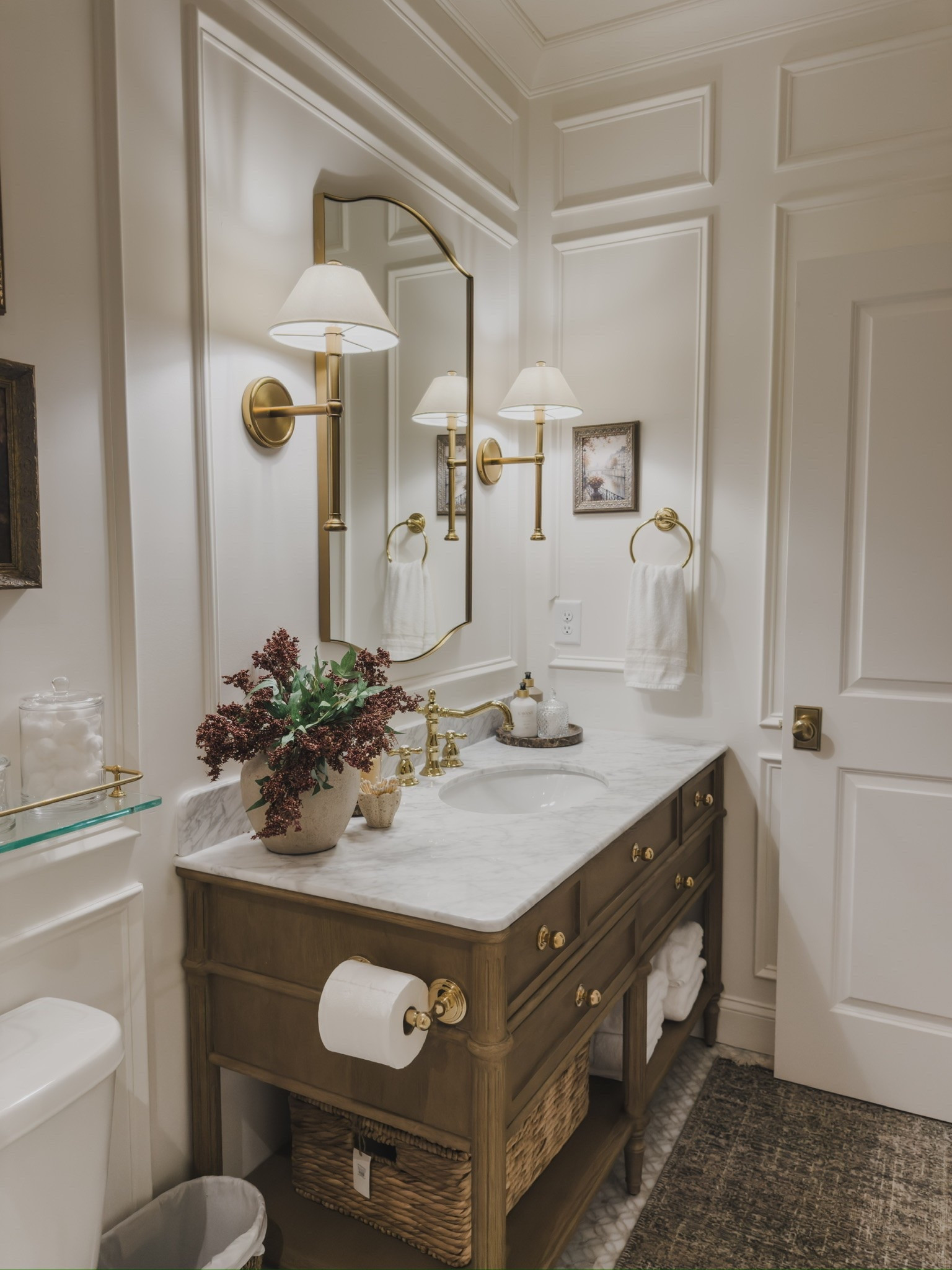 Adding small fall touches to my primary guest bathroom! Keeping this space timeless and adding elements such as seasonal stems and art for a collected and cozy space.

Home finds, neutral home inspo, guest bathroom, timeless details, collected style, neutral wood tones, fall refresh, faux fall stems, brass details, statement lighting, brass hardware, wainscoting detail, vintage style area rug, statement mirror, glass wall shelf, bathroom essentials, Wayfair, Rejuvenation, Four Hands, Anthropologie, Etsy, found it on Amazon, shop the look!

#LTKSeasonal #LTKHome