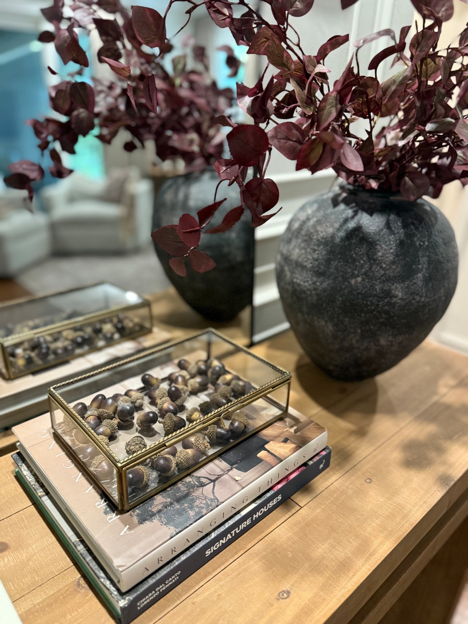 Fall decor
Console
Styling
Acorn filler in glass box
Plum purple stems in large black vase
Wood console table 

#LTKFallSale #LTKHalloween #LTKSeasonal