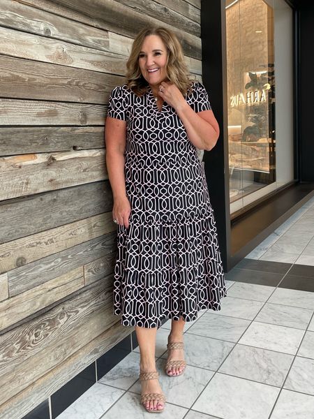 This dress is made with the Jude Connally signature fabric. It’s a knit that def wouldn’t wrinkle. A great travel dress. 

It’s black with a pale blush geometric. I’m in a L  

Spring dress, Easter dress. 