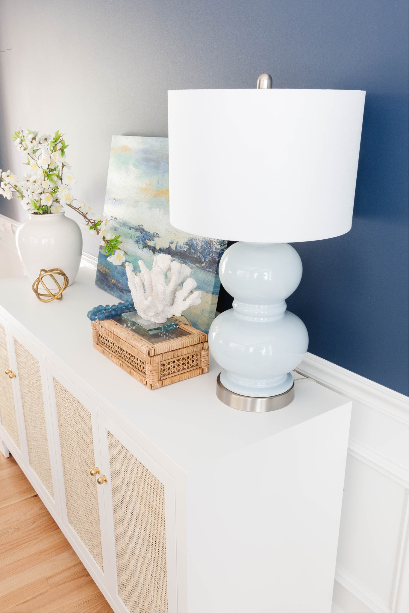 Coastal home decor, coastal decor, blue lamp, white console, cane and rattan box, recycled glass beads, coral



#LTKsalealert #LTKfindsunder100 #LTKhome