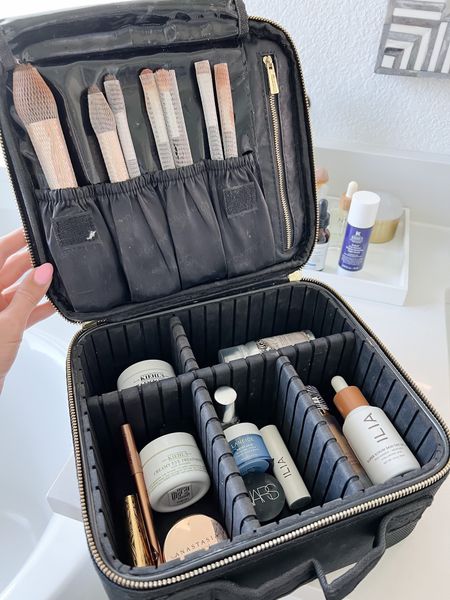 Travel makeup bag I cannot live without! I take this every time I travel because I love the adjustable compartments that allow me to put makeup and skincare in it. Less than $25, too! 

#LTKtravel #LTKbeauty
