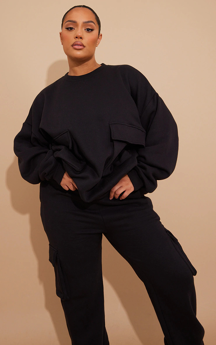 Plus Black Cargo Oversized Sweatshirt | PrettyLittleThing US