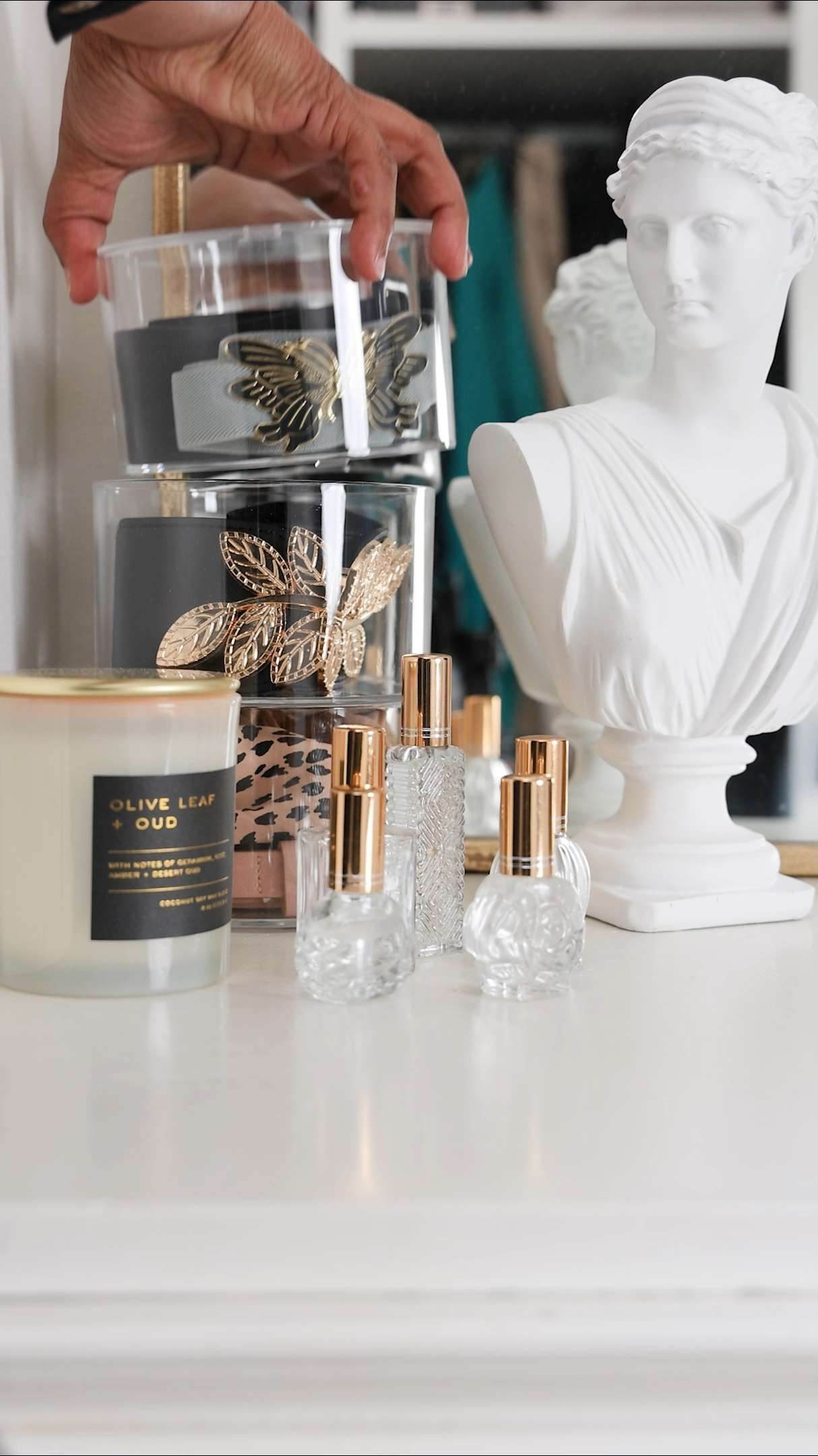 Attractive closet storage and styling | Acrylic belt organizer | Refillable perfume bottles | Statue bust | makeup vanity 

 #LTKHome