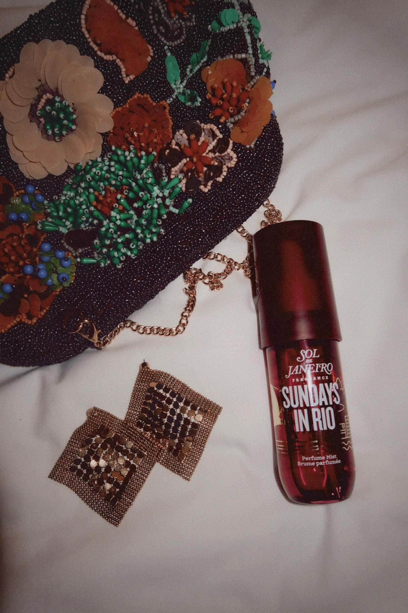 The only perfume body spray that came to NYC with me! My fave new scent from Sol De Janeiro! Sundays in Rio is the perfect fall scent! And it’s limited edition! So good!!! 
Earrings and bag are Zara I can’t link them but I linked similar styles for you!!! 

Fall style, fall beauty, fall bag, fall accessories, date night style, beauty finds, travel style, NYFW, beaded bag, clutch, statement earrings 

#LTKNYFW #LTKItBag #LTKBeauty